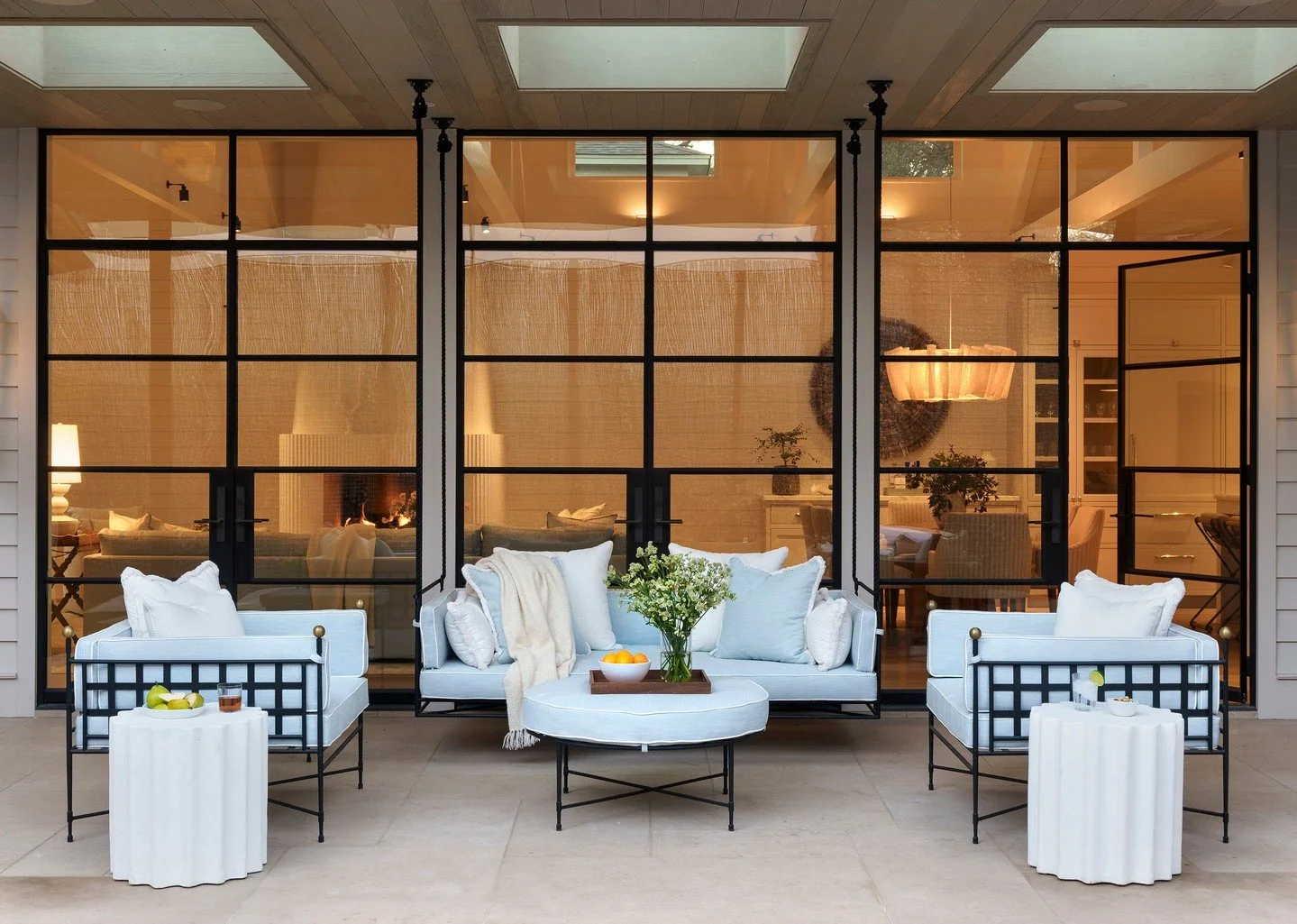 This space was inspired by something simple and sentimental. As a little girl, our client loved to swing, and she always dreamed of having a porch swing of her own.

With a fairly narrow footprint overlooking the pool, we designed a custom hanging da