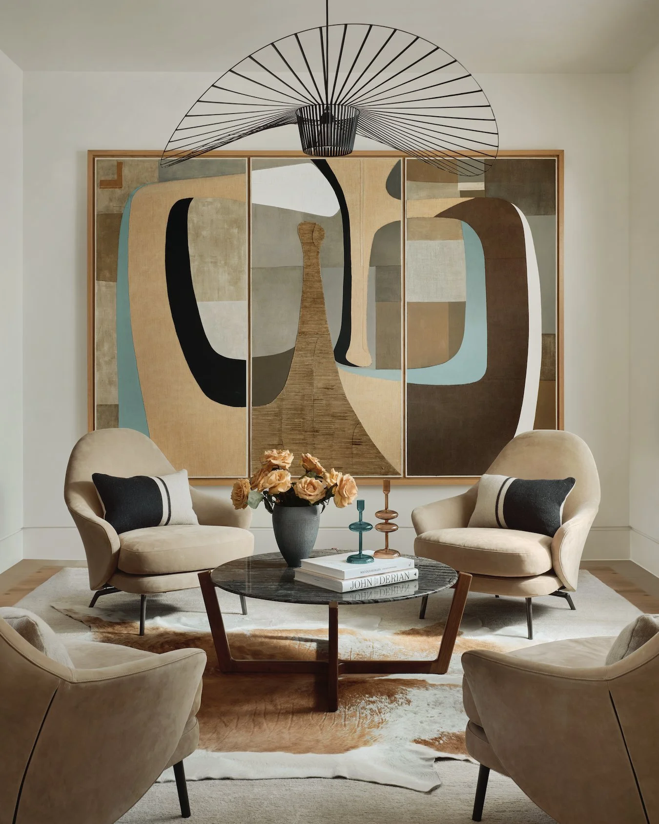 This room was designed around a single piece of art, letting it set the tone for every decision. Furniture, lighting, and layout were carefully chosen to complement its presence, creating a space that feels intentional yet effortless. Depending on th