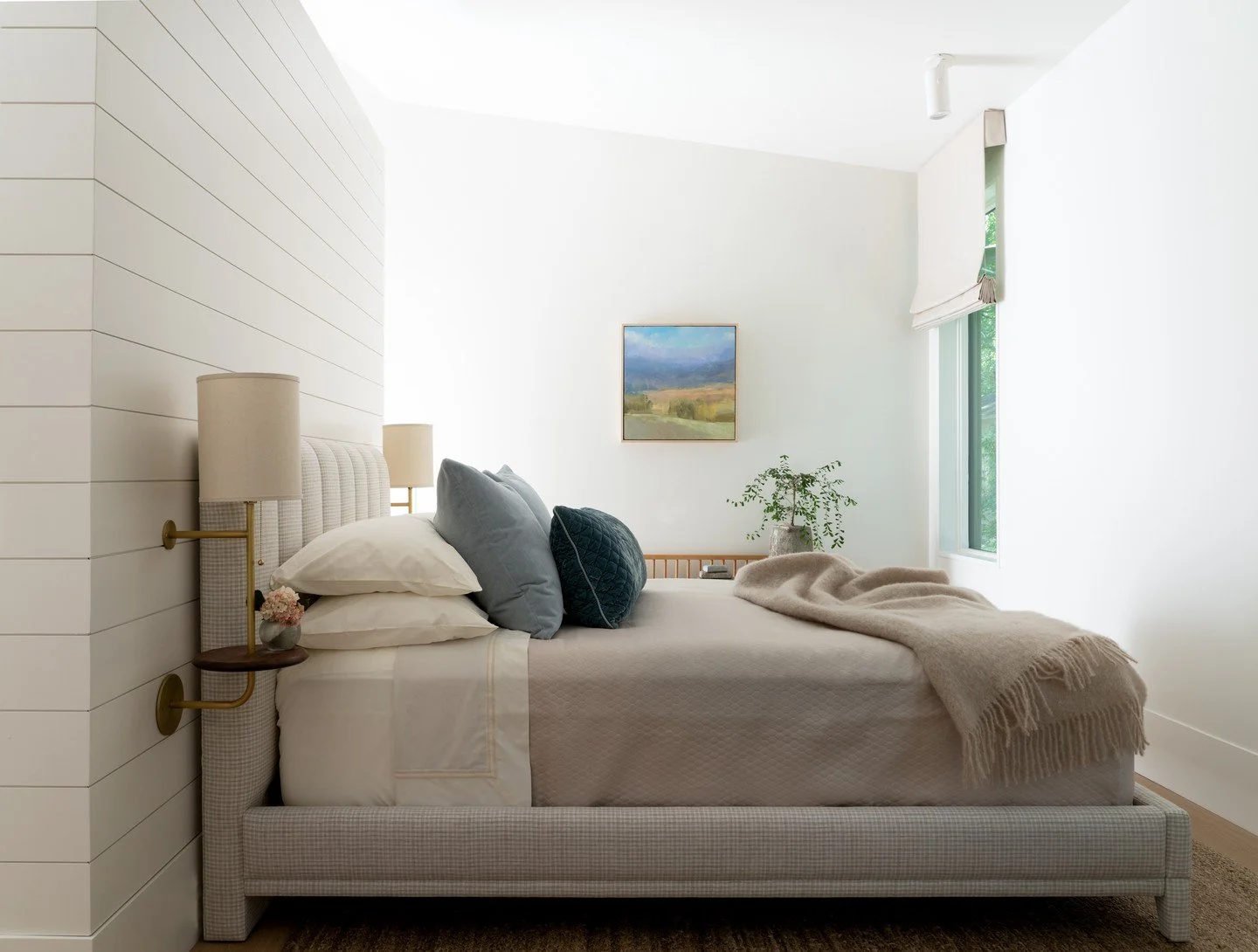 A masterful study in layering textures, where a quiet palette allows each material to feel intentional and elevated.

Soft, natural elements, a simple plant, and a small art piece bring subtle character and warmth, adding quiet layers that ground the