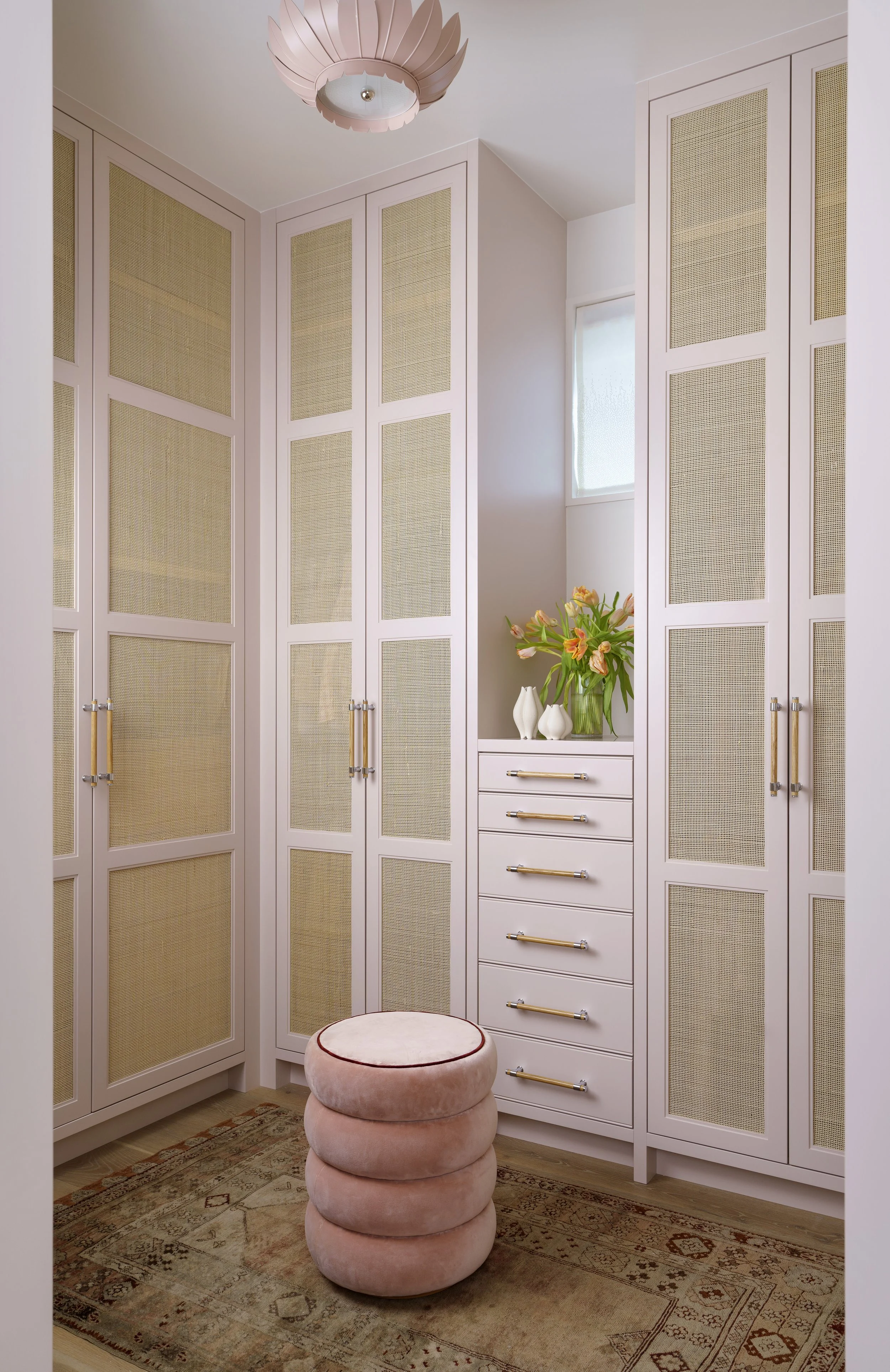 Custom closet with cabinetry and textural elements