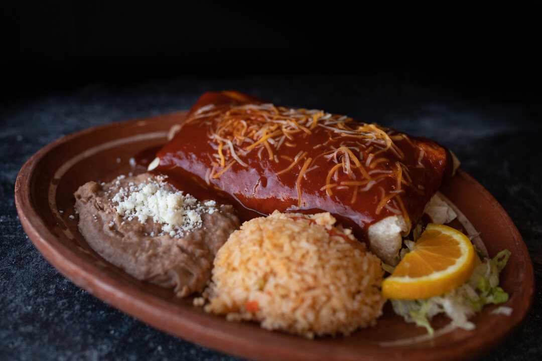 Happy Hump Day! If you're feeling extra hungry today, may we suggest the Deluxe Burrito? Huge burrito stuffed with your choice of meat, cheese, onions. cilantro, hot salsa, rice and whole beans, and smothered in our house made red sauce and melty che