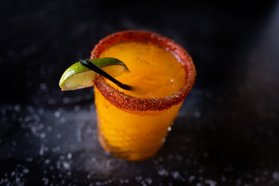 The Chamoy Margarita is a sweet and tangy treat. Rimmed with Chamoy and Tajin, and shaken to perfection- this Mango Margarita is a dream! 🥭🌵