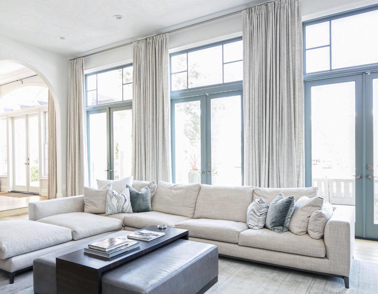 Sliding/accordion doors are amazing, but a set of three French doors is just as good in my opinion. #interiordesign #familyroom #sectional #interiordesignersofinsta