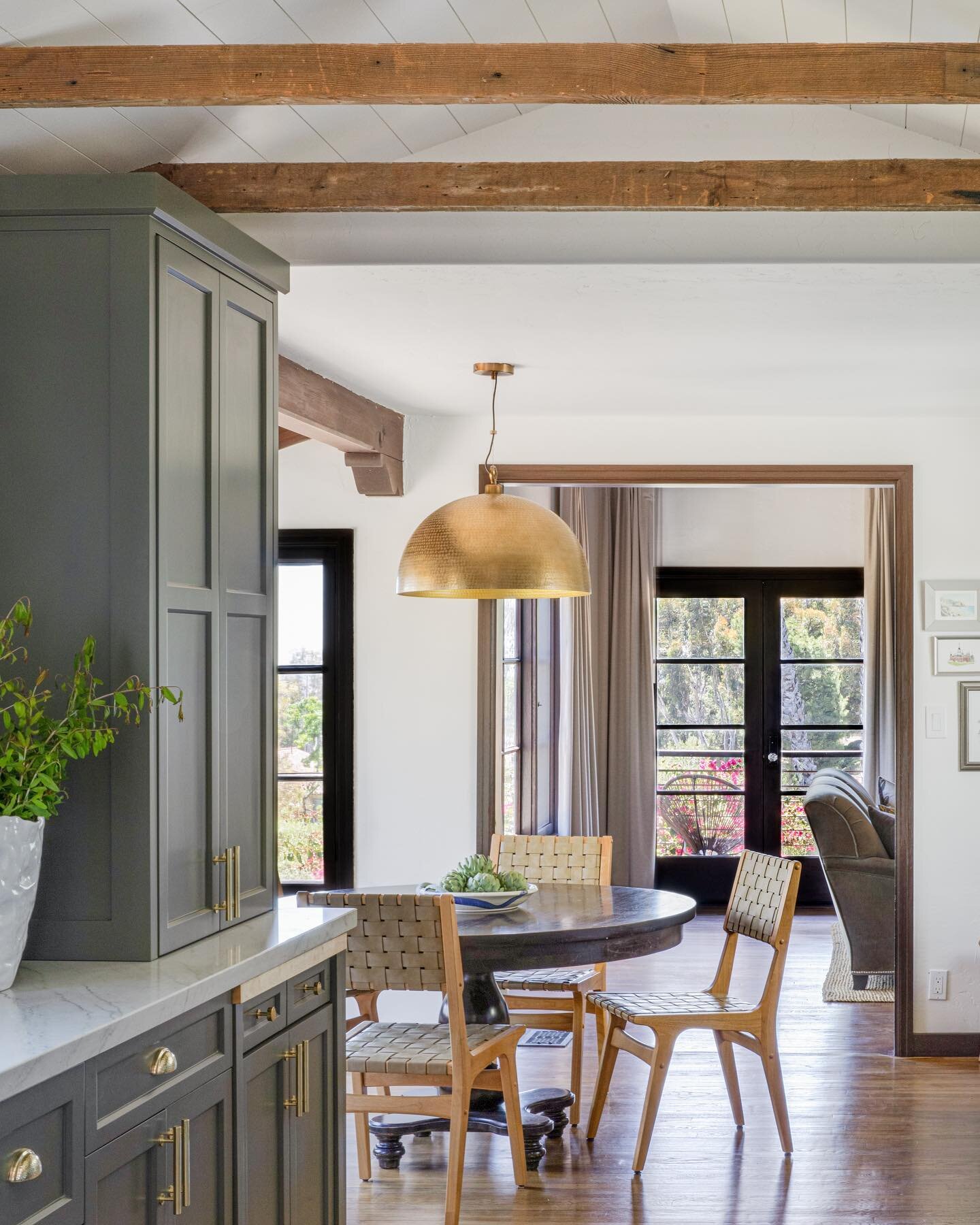 This historic home was updated fully updated, but so many original great elements are still in place. The flooring all original, plaster walls, and these weathered ceiling beams that used to be covered now show so well. #spanishmodern #modernspanish 