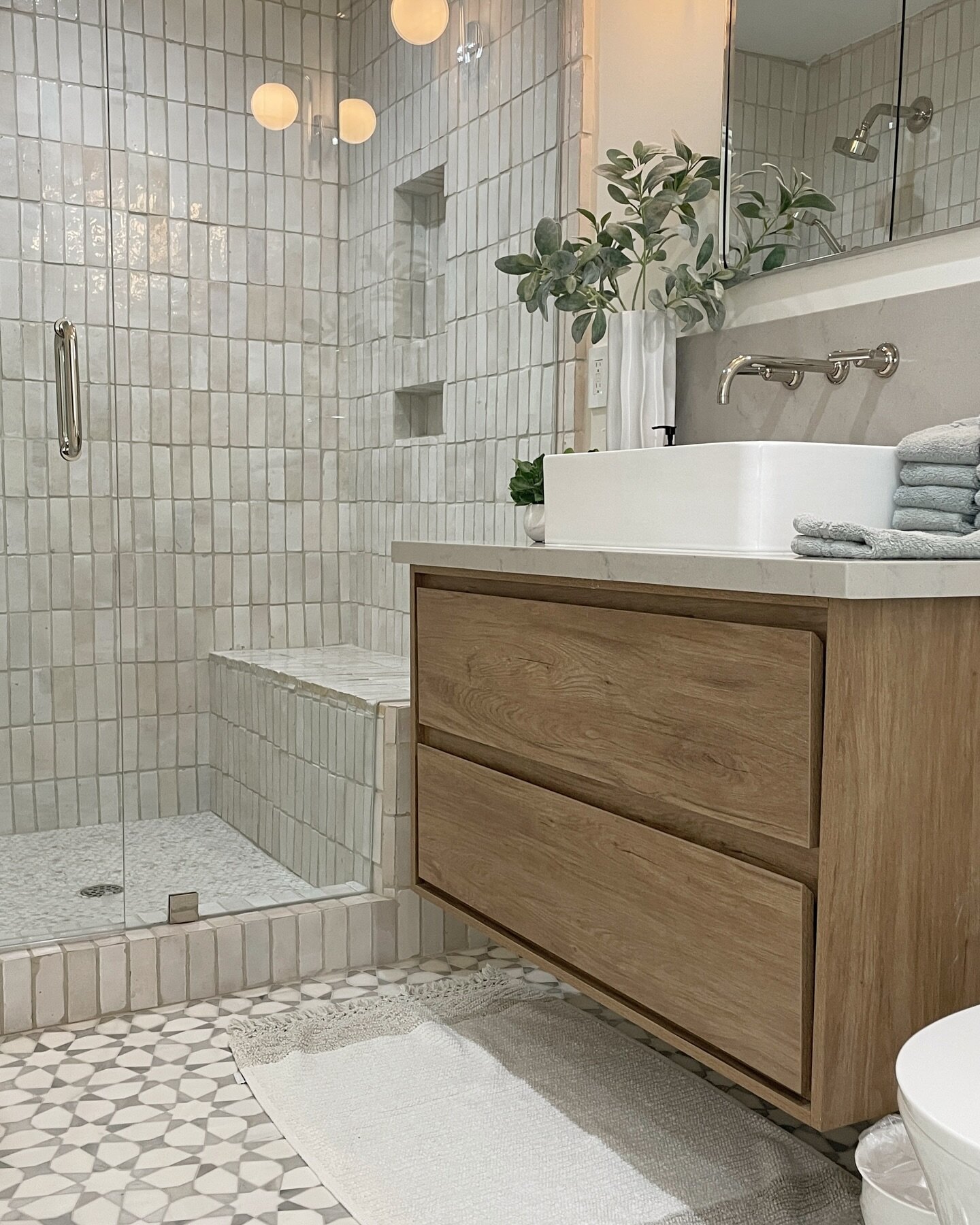 A simple setting in this space, and no the showerhead is not installed above the vanity 🙂. #multitasking #bathroomsofinstagram #bathroomsofinsta #modernbathroom #zellige #zelligetiles #cletile @cletile