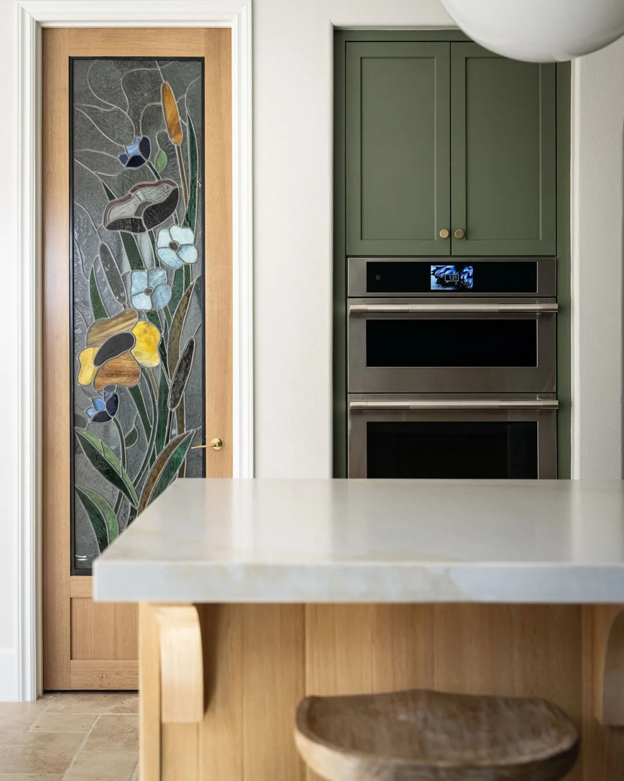 Our client inherited this stain glass panel, so it just had to be incorporated into this kitchen. We used it on the pantry door, and it brought the perfect amount of nostalgia into this new kitchen remodel. 
.
.
.
.
.
.
#kitchenremodel #stainglass #s