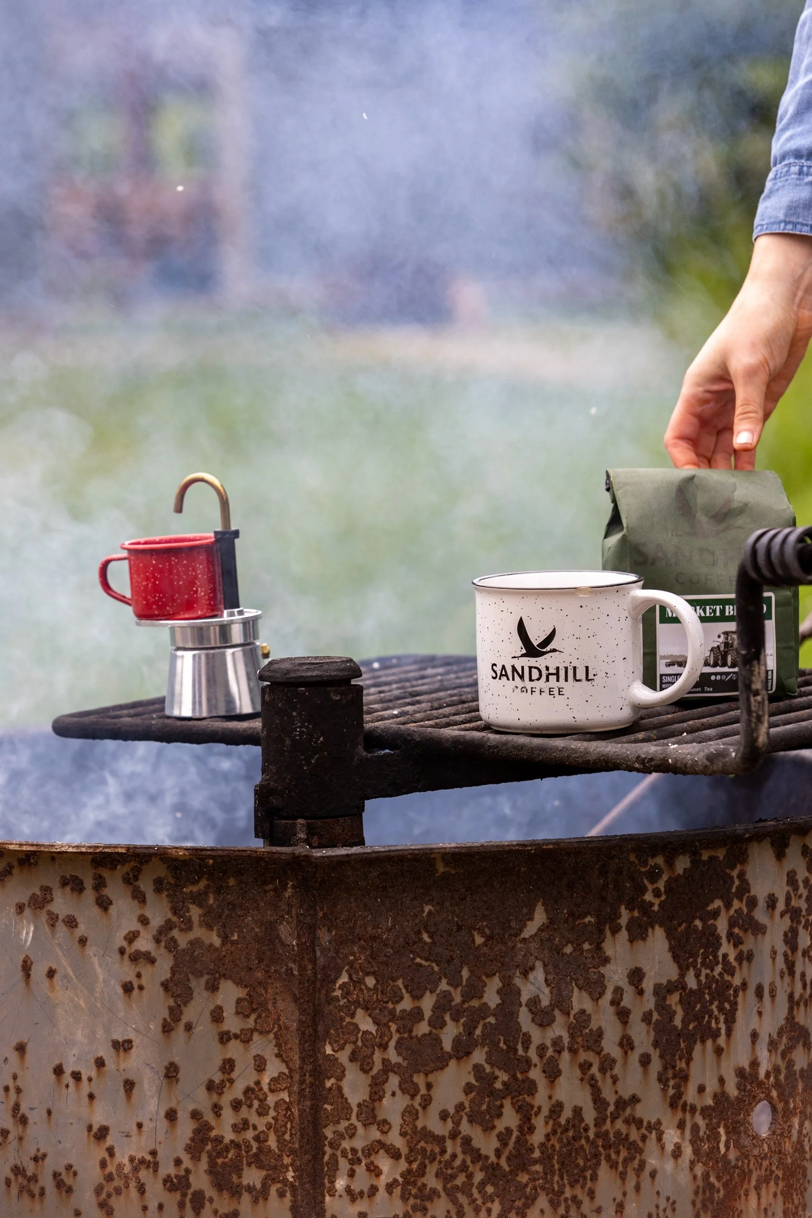 A photo of coffee being made over a campfire at Camp Bullfrog Lake near Lemont Downtown, Illinois.