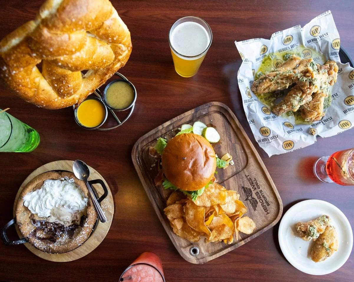 A photo of a pretzel, burger, chips, wings, and dessert at Heroes West Lemont in Lemont Downtown, Illinois.