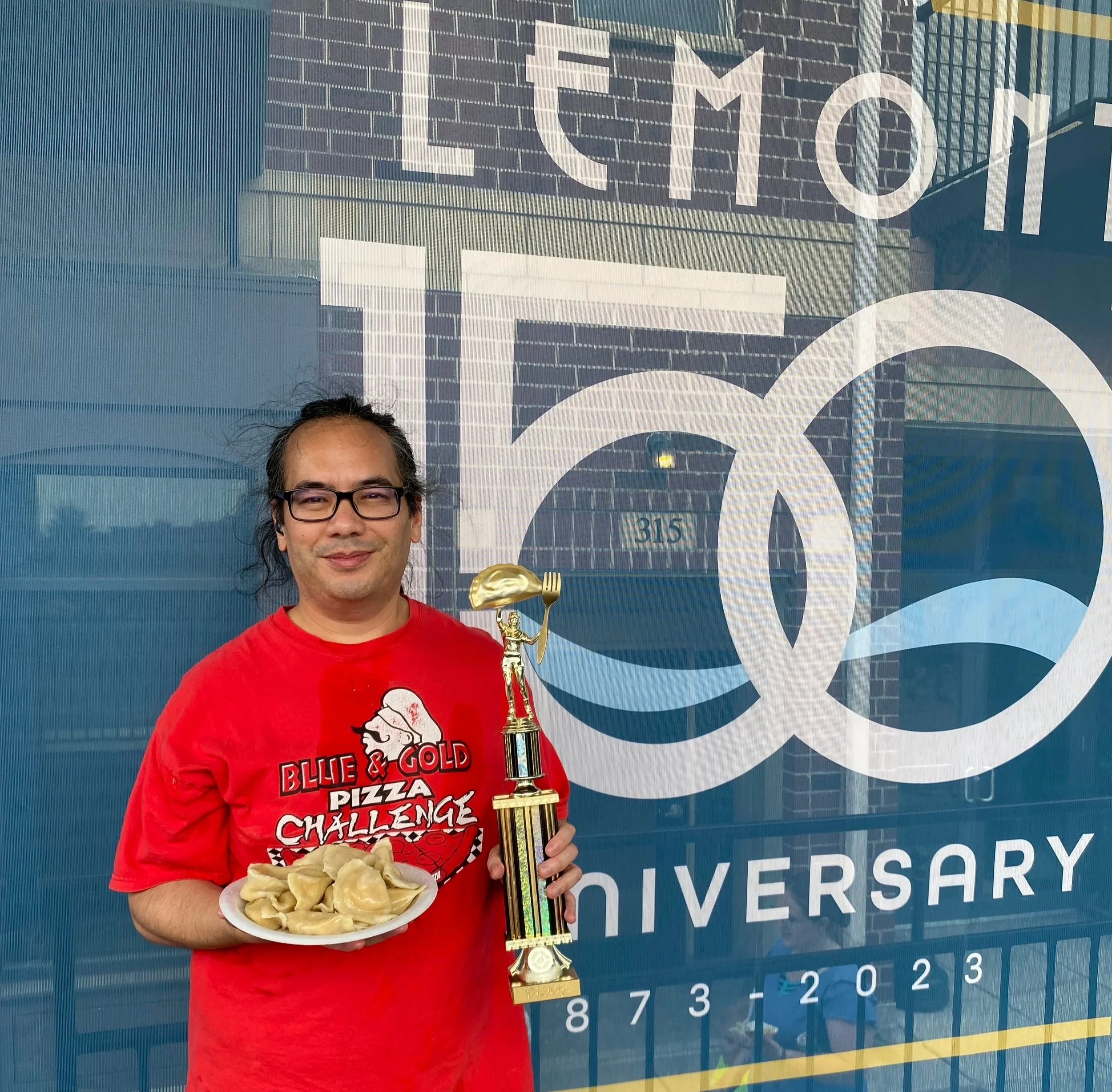 A photo of the pierogi eating contest winner in Lemont Downtown, Illinois.
