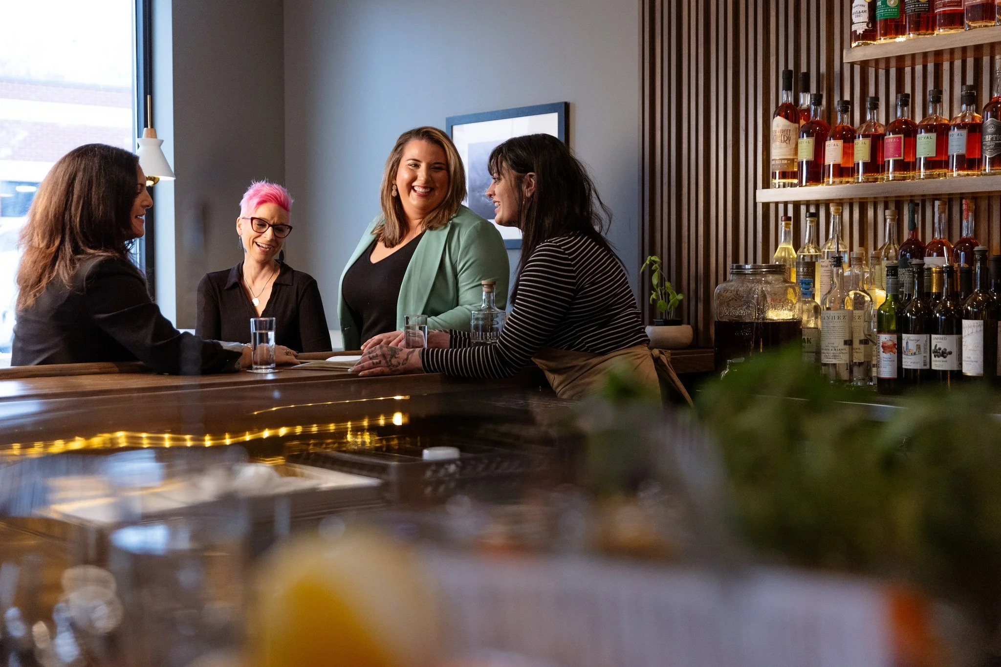 A photo of four women at Pollyanna Social, a cocktail bar, located in Lemont Downtown, Illinois.