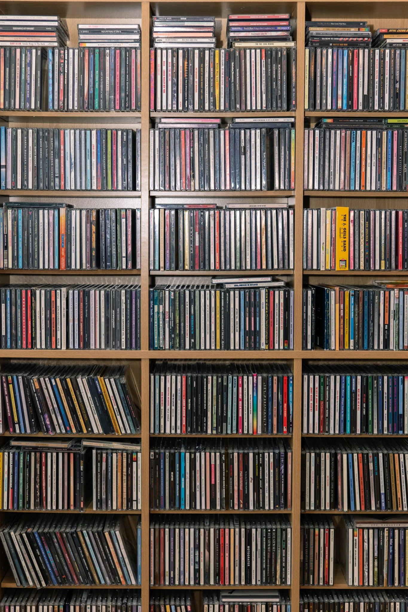 A photo of CDs available at B-Side Records/Moose Vinyl, located in Lemont Downtown, Illinois.