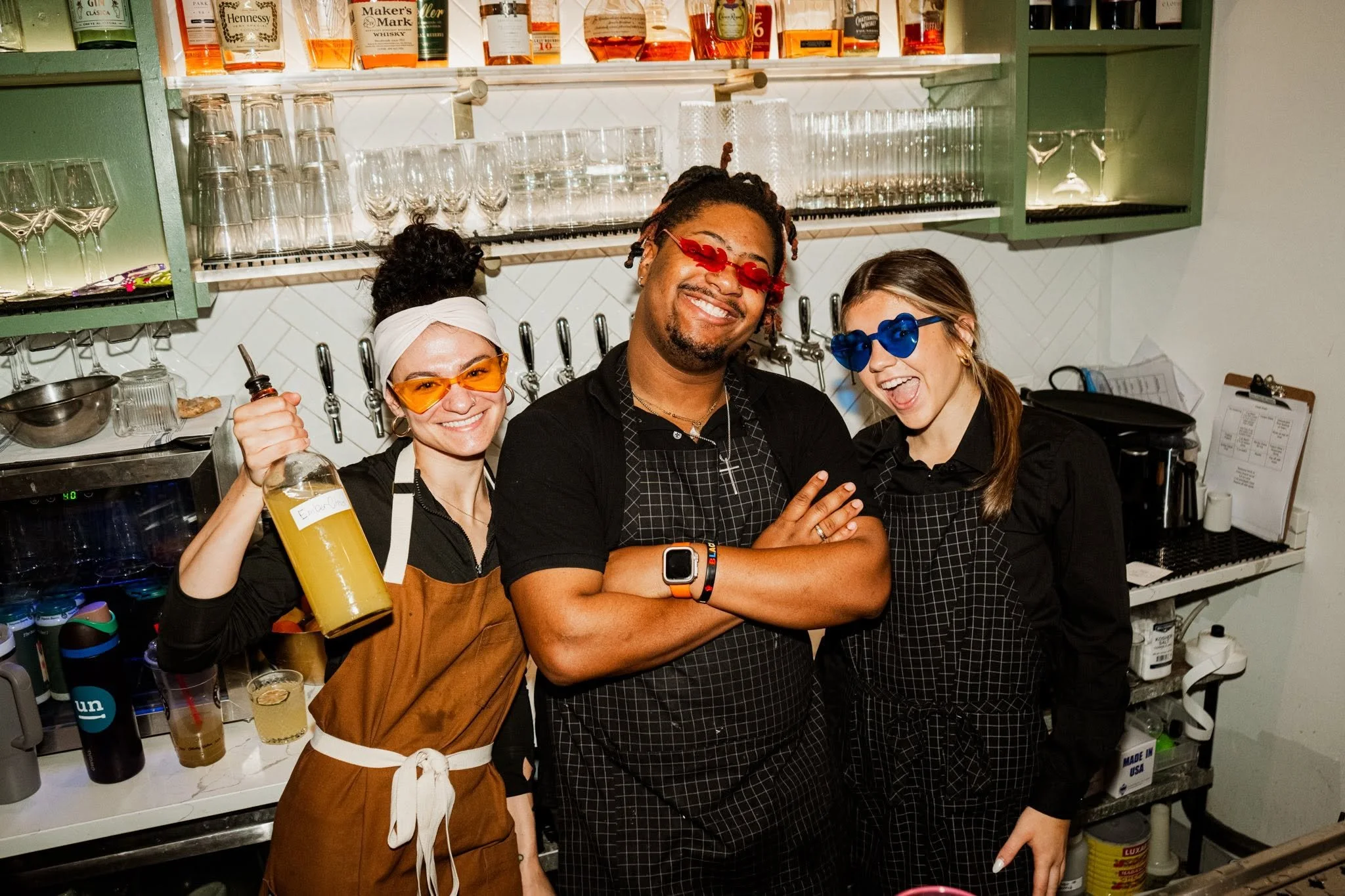 A photo of three staff members at Wooden Paddle in Lemont Downtown, Illinois.