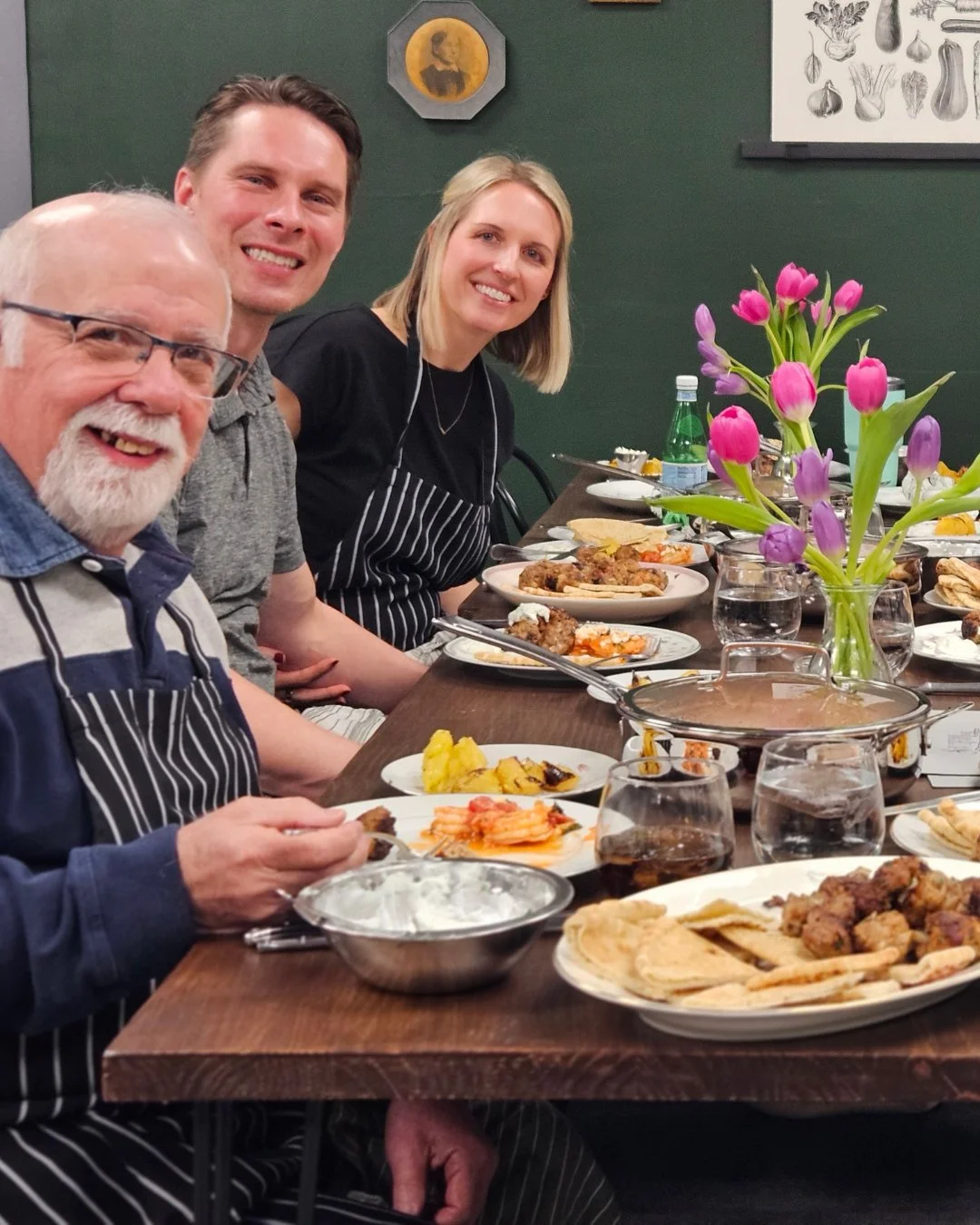A group of colleagues enjoying a  meal after class at Southernish Cooking School in Lemont, IL