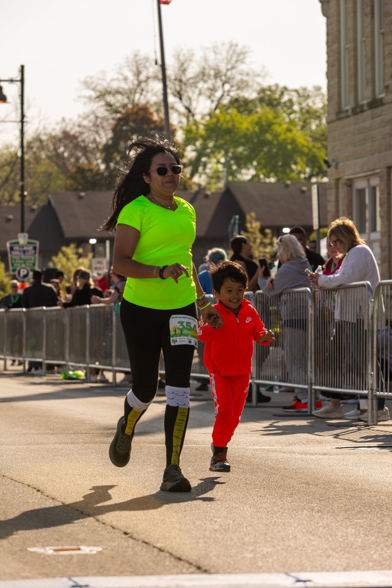 A photo of a mother and child participating in the Quarryman Challenge in Lemont Downtown, Illinois.