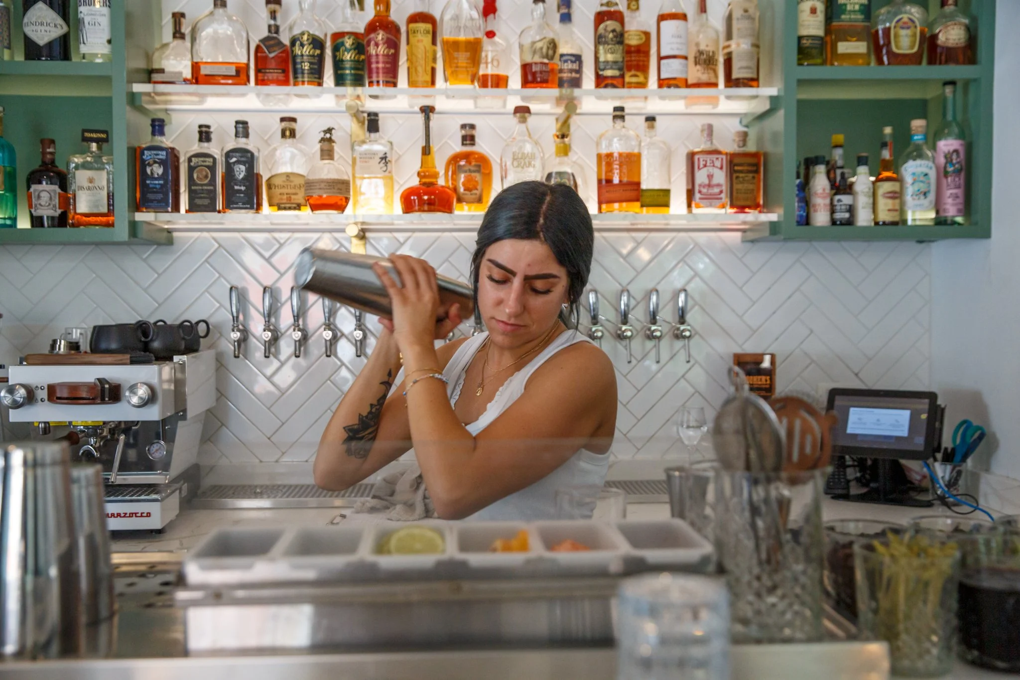 A photo of a bartender making a cocktail at Wooden Paddle in Lemont, Illinois.