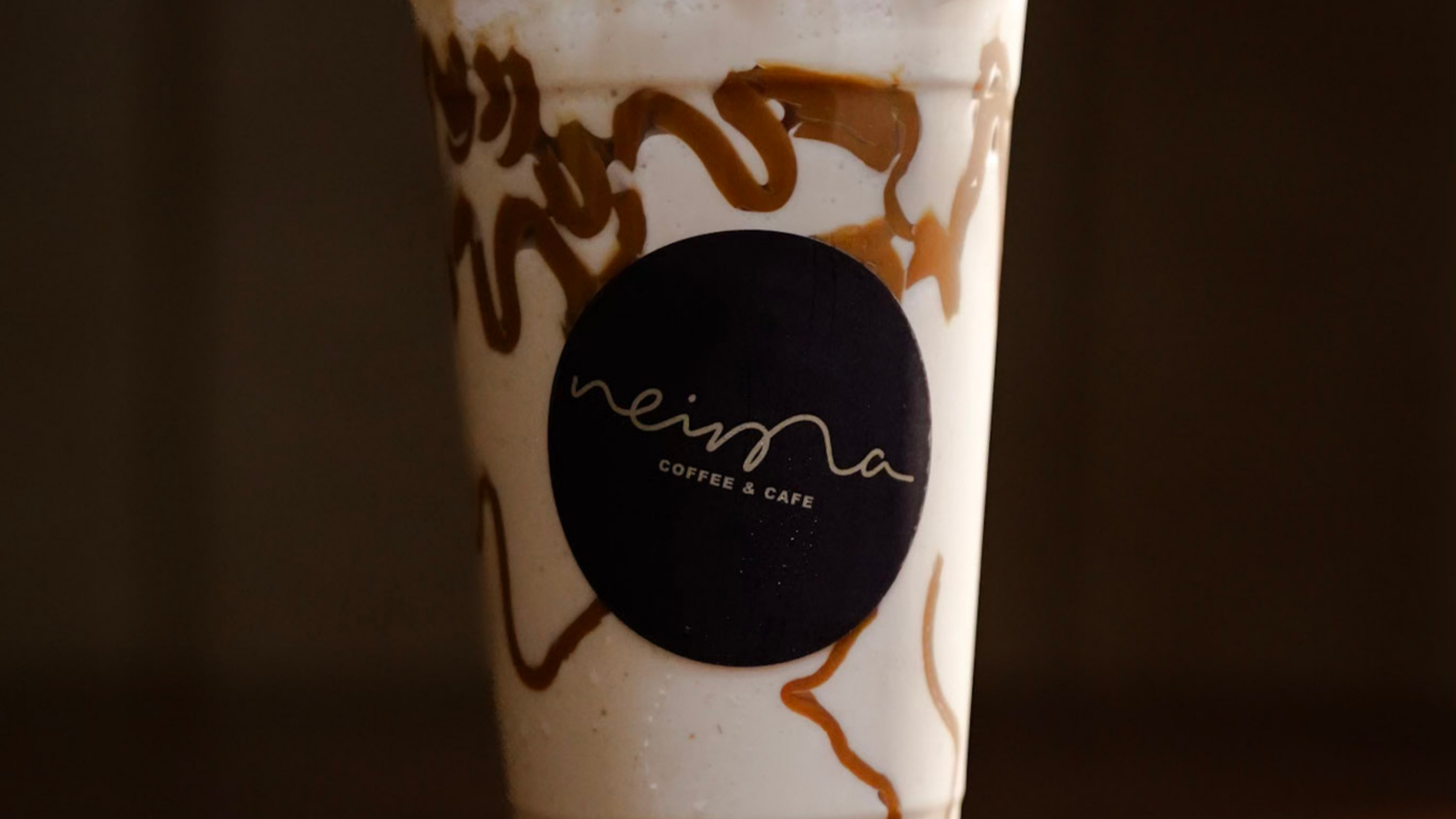 A photo of an iced coffee beverage from Neima Coffee & Cafe in Lemont Downtown, Illinois.