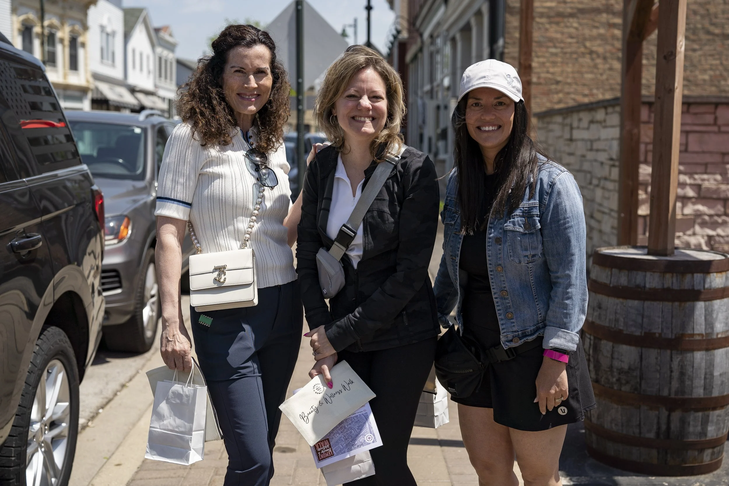 A photo of three mothers at the annual Beauty & Wellness Walk in Lemont Downtown, Illinois.