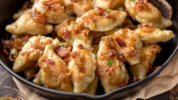 A photo of pierogis in a cast iron skillet in Lemont Downtown, Illinois.