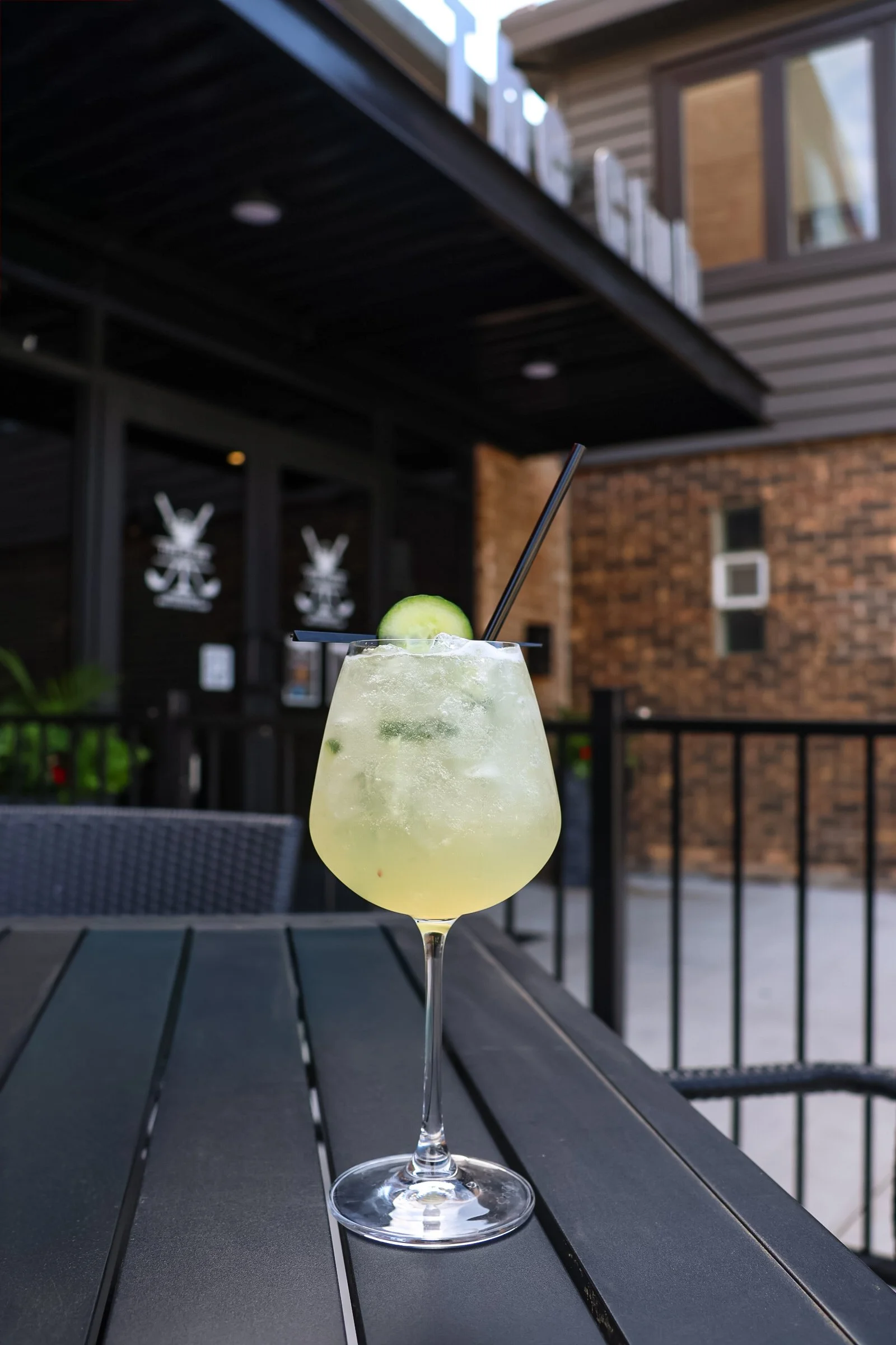 A photo of a cucumber elderflower spritz, a cocktail available at The Club in Lemont Downtown.