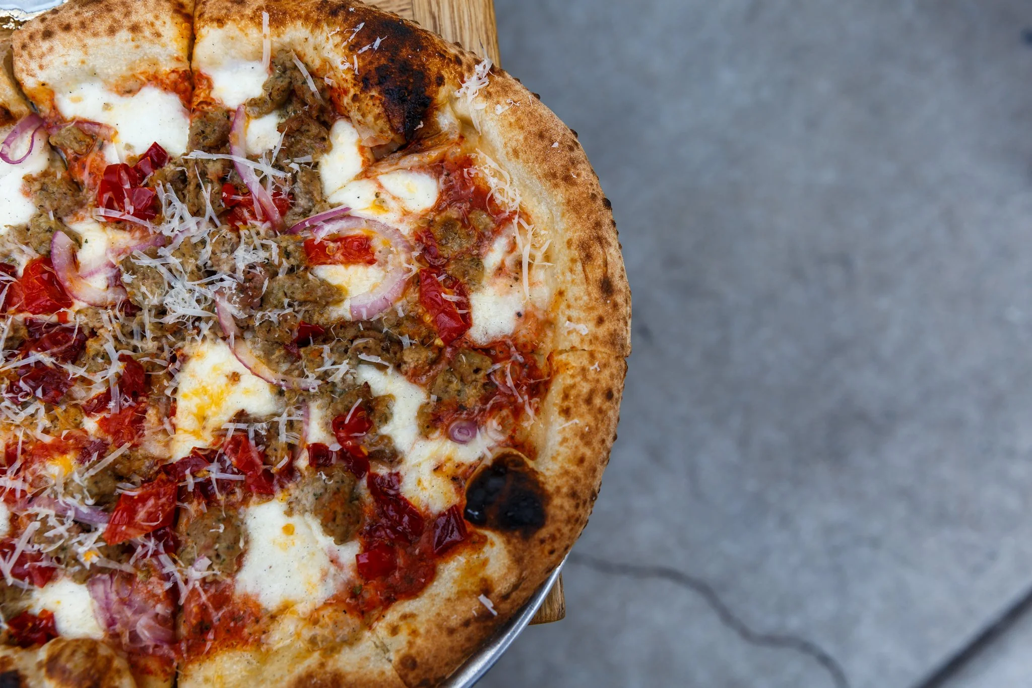 A photo of wood-fired pizza available at Wooden Paddle in Lemont, Illinois.
