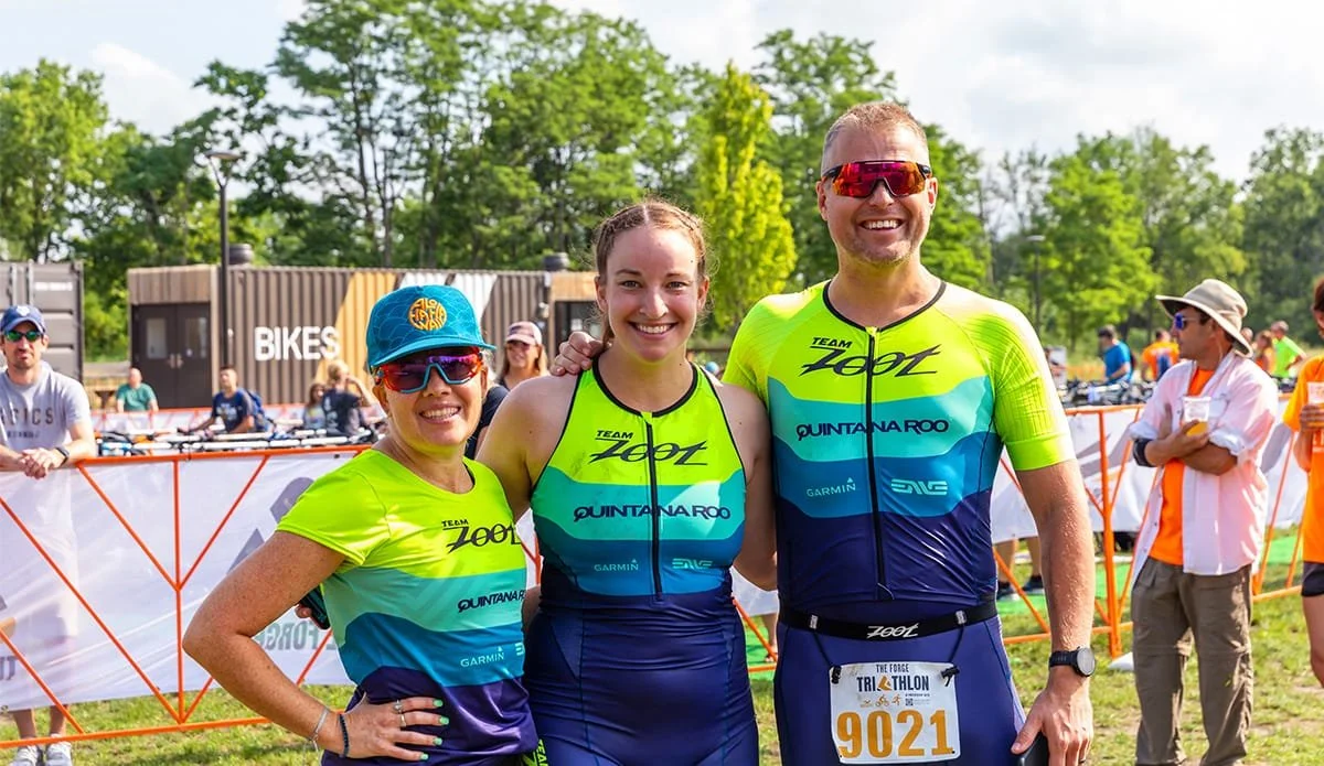 A photo of three triathalon participants in Lemont Downtown, Illinois.