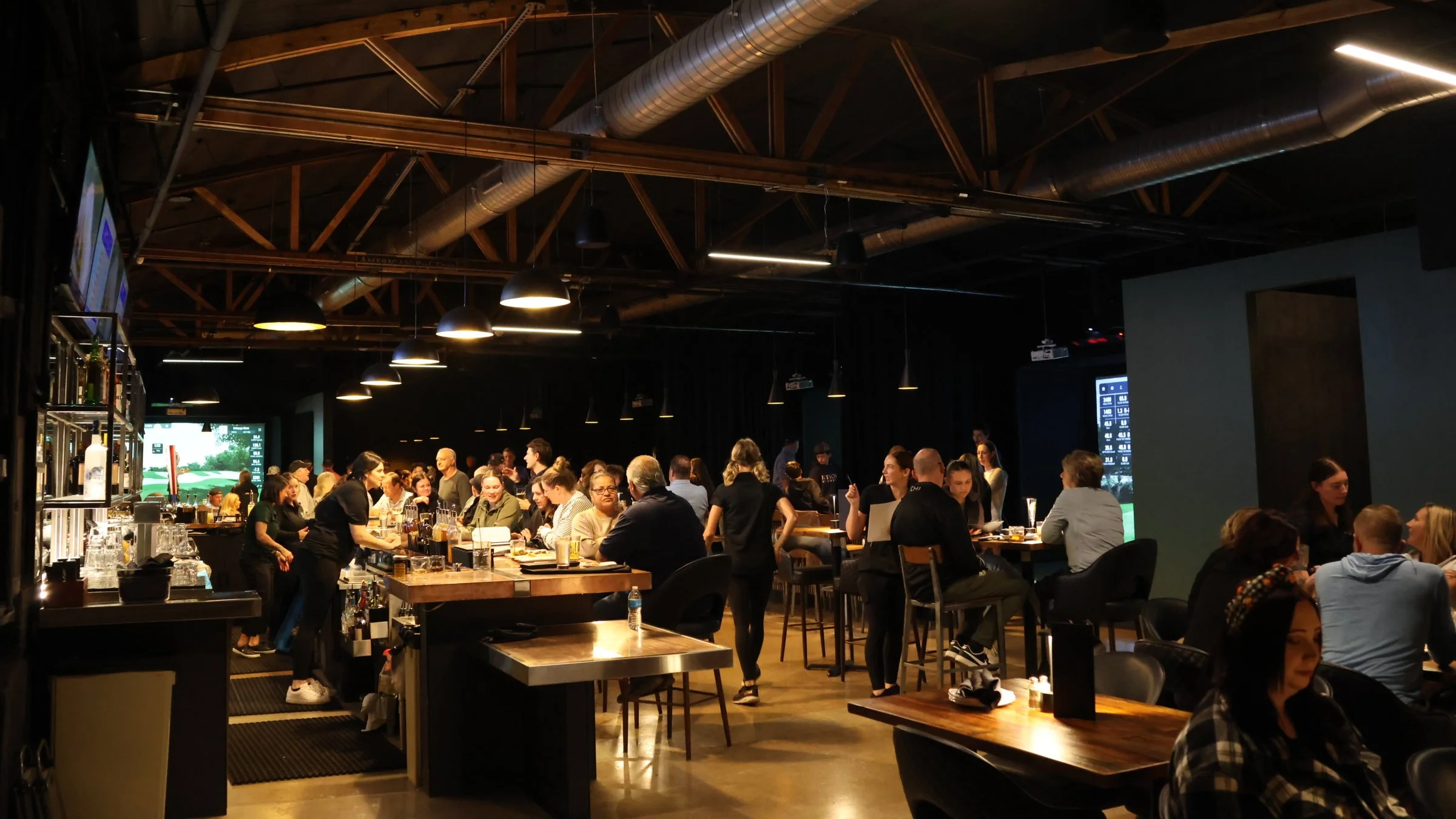 A photo of customers socializing and dining at The Club in Lemont, Illinois.