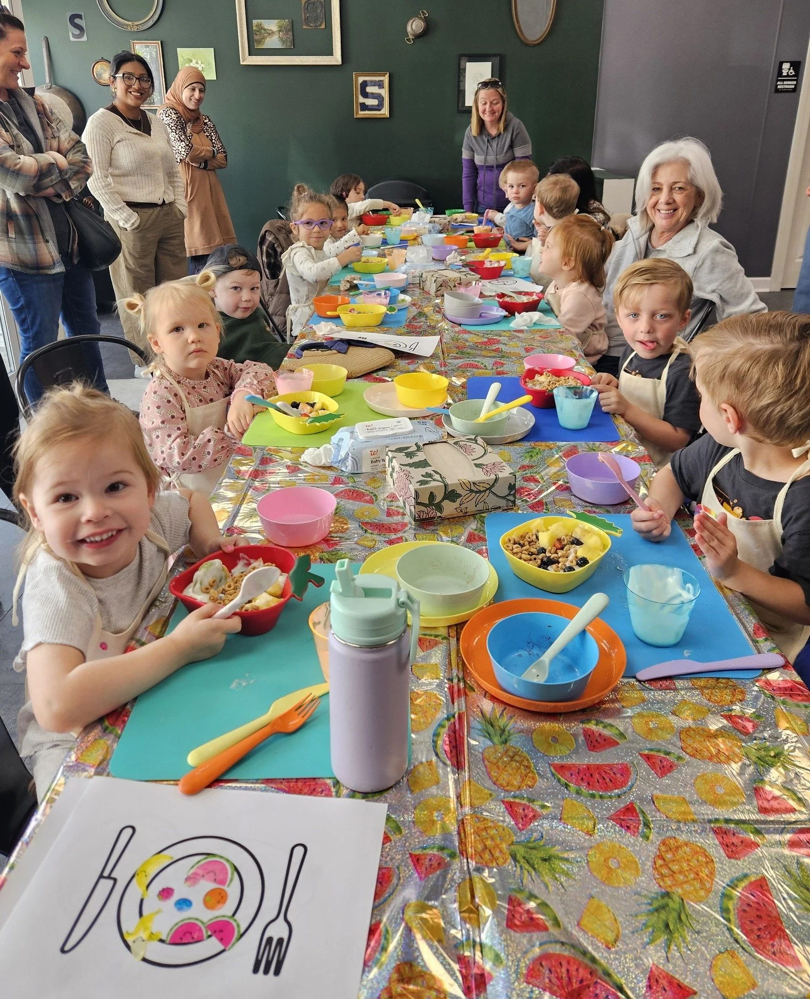A group of children around a table at Southernish cooking school in Lemont, IL after attending one of the kids classes
