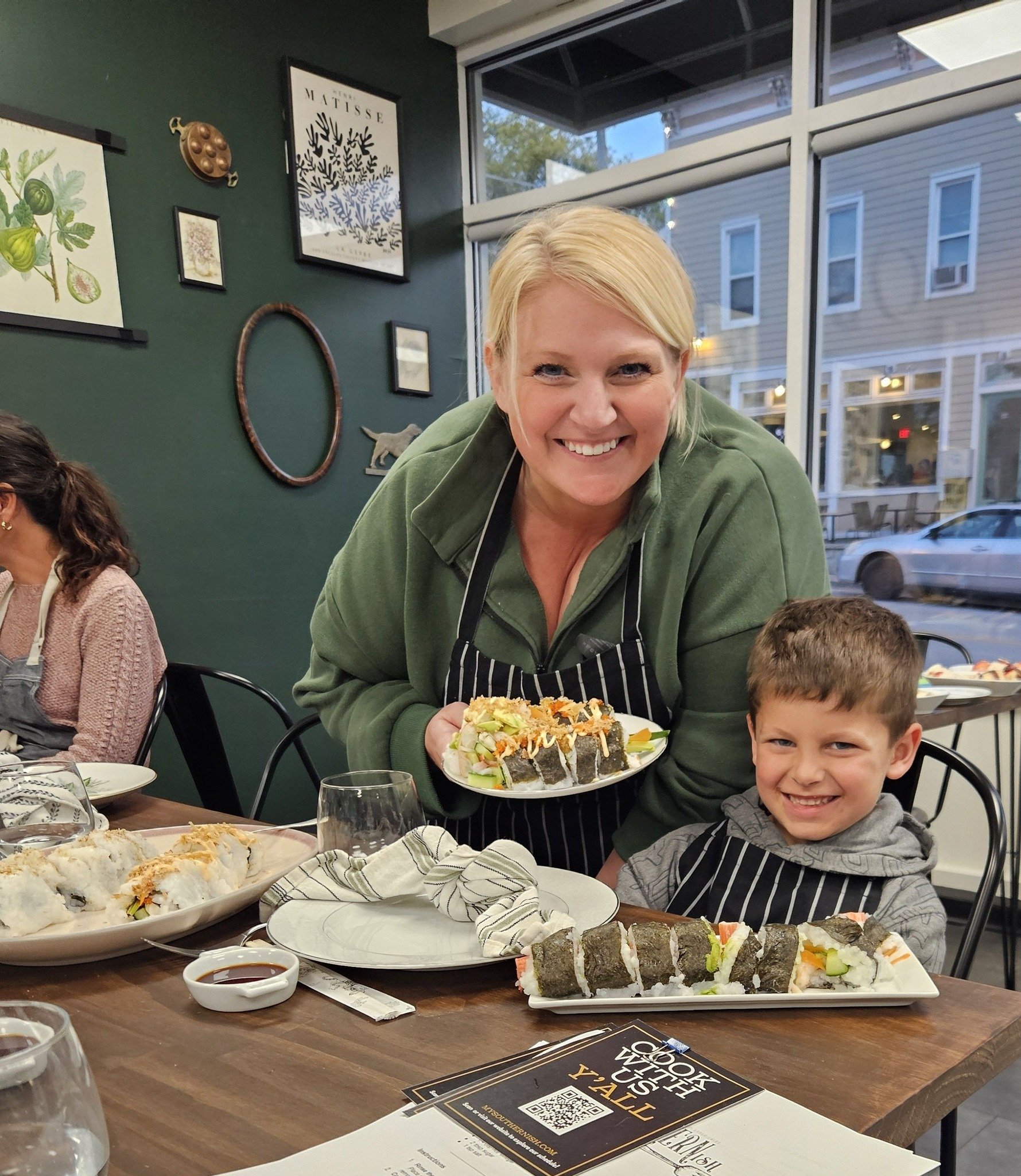 A woman and child enjoying a sushi meal at Southernish Cooking Studio in Lemont, iL