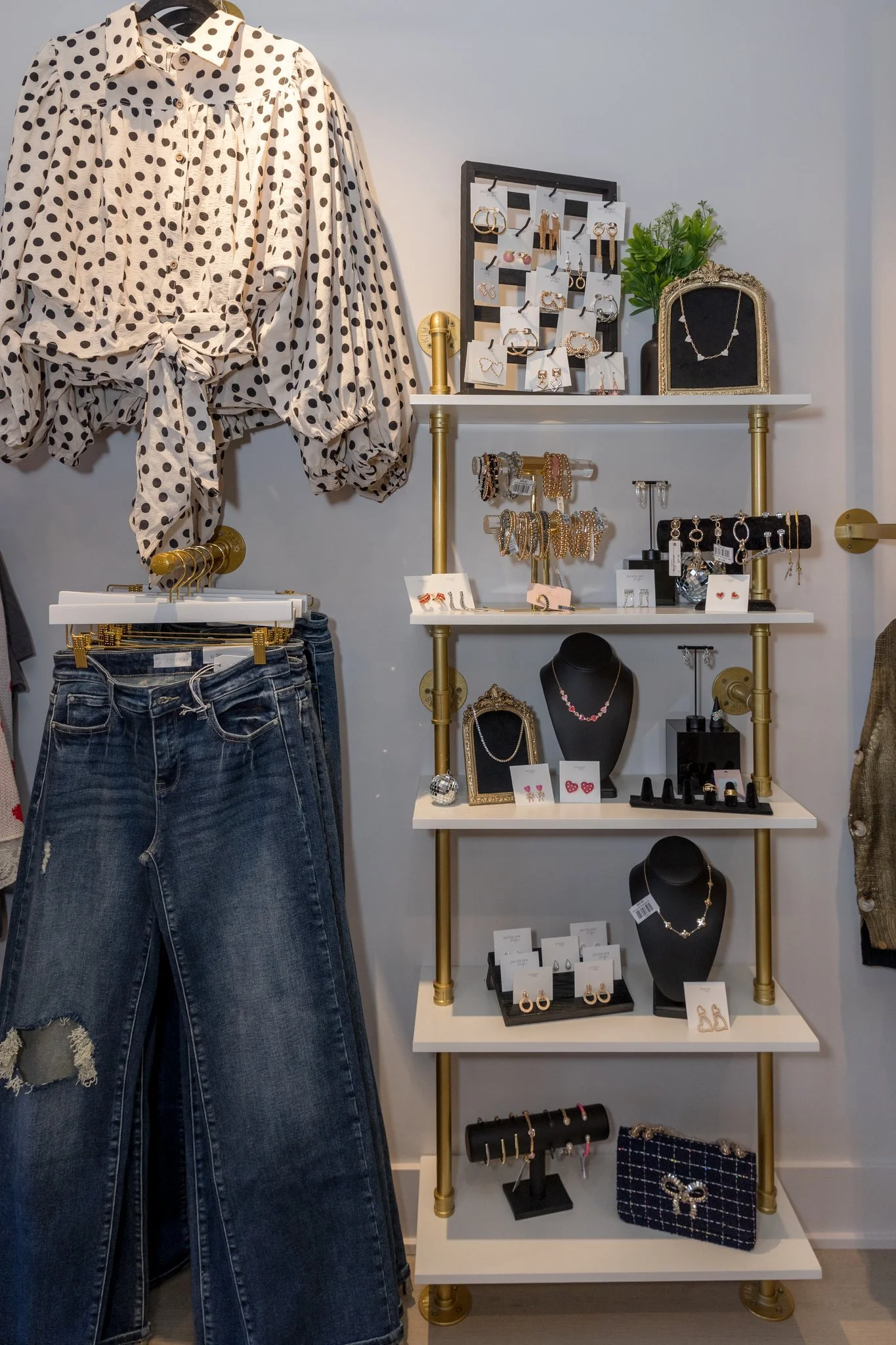 A photo of purses, shoes, sweaters, cardigans, bottoms, pants, tops, and jewelry available at Jaclyn Sue Boutique in Lemont Downtown, Illinois.