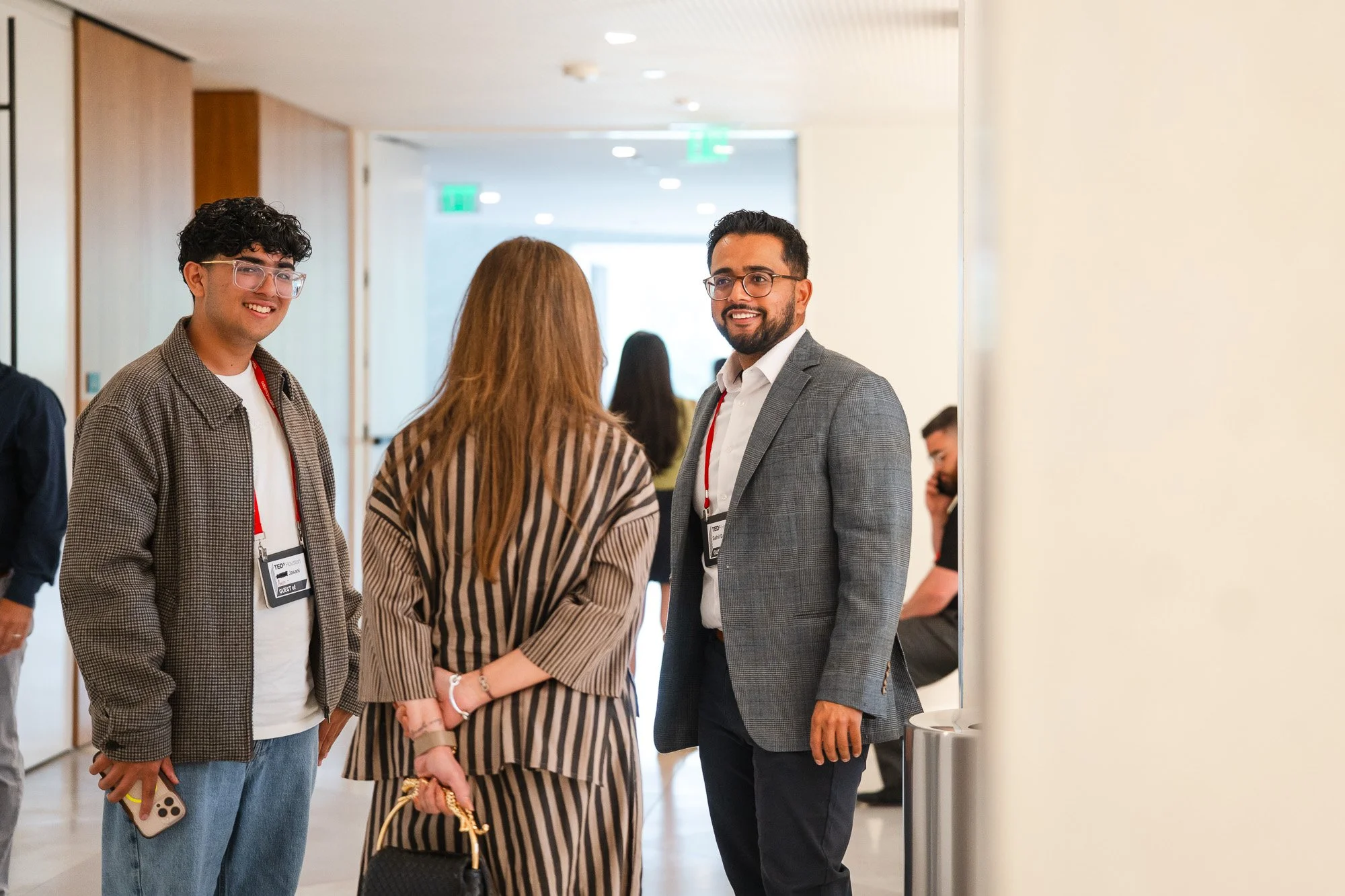 A group of conference attendees mingling during a networking session