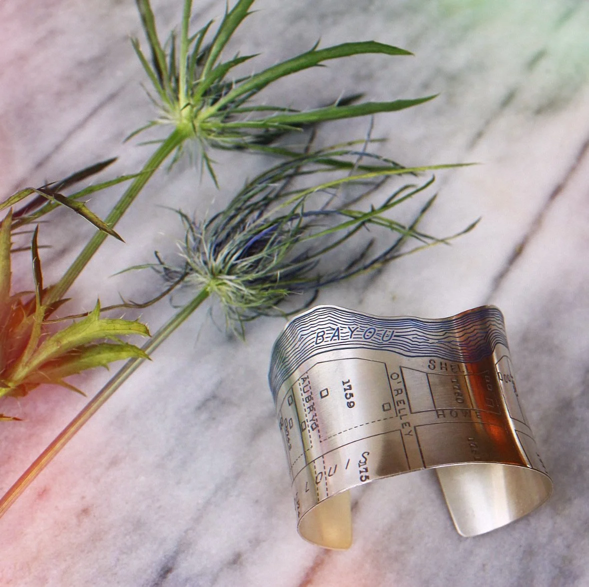 Bayou St. John has always felt like its own quiet world, and I wanted this cuff to carry a bit of that calm with it.  Handcrafted in sterling silver, it follows the curve of the water the way I&rsquo;ve walked it a hundred times -slow, familiar, grou