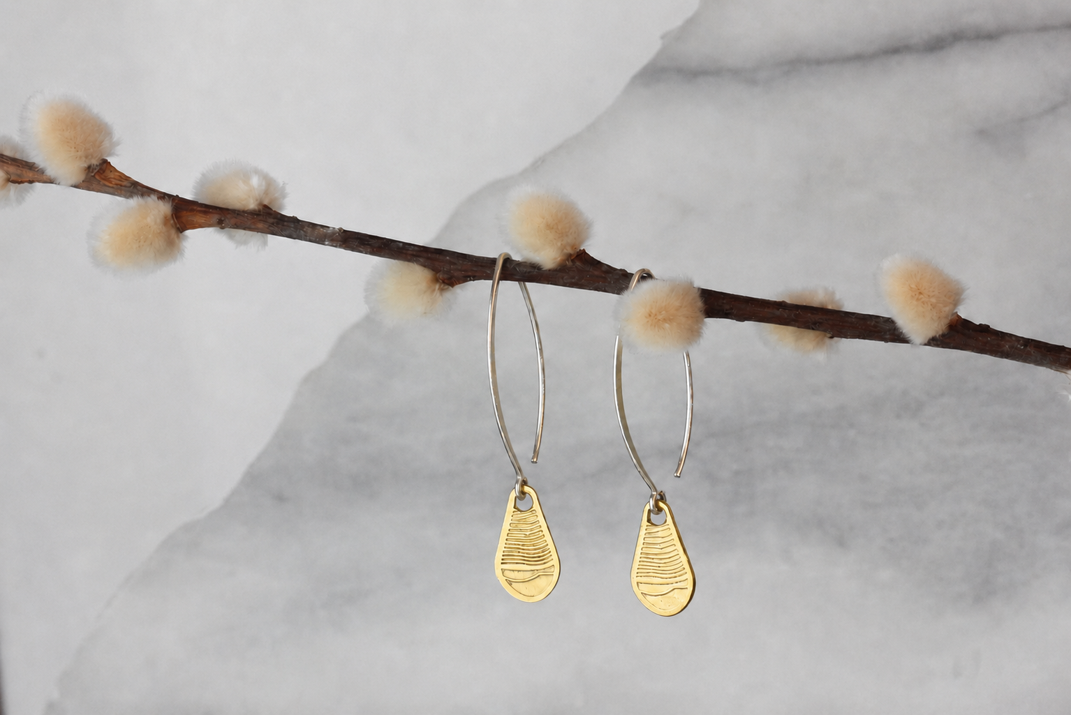 Alluvial brass earring .png
