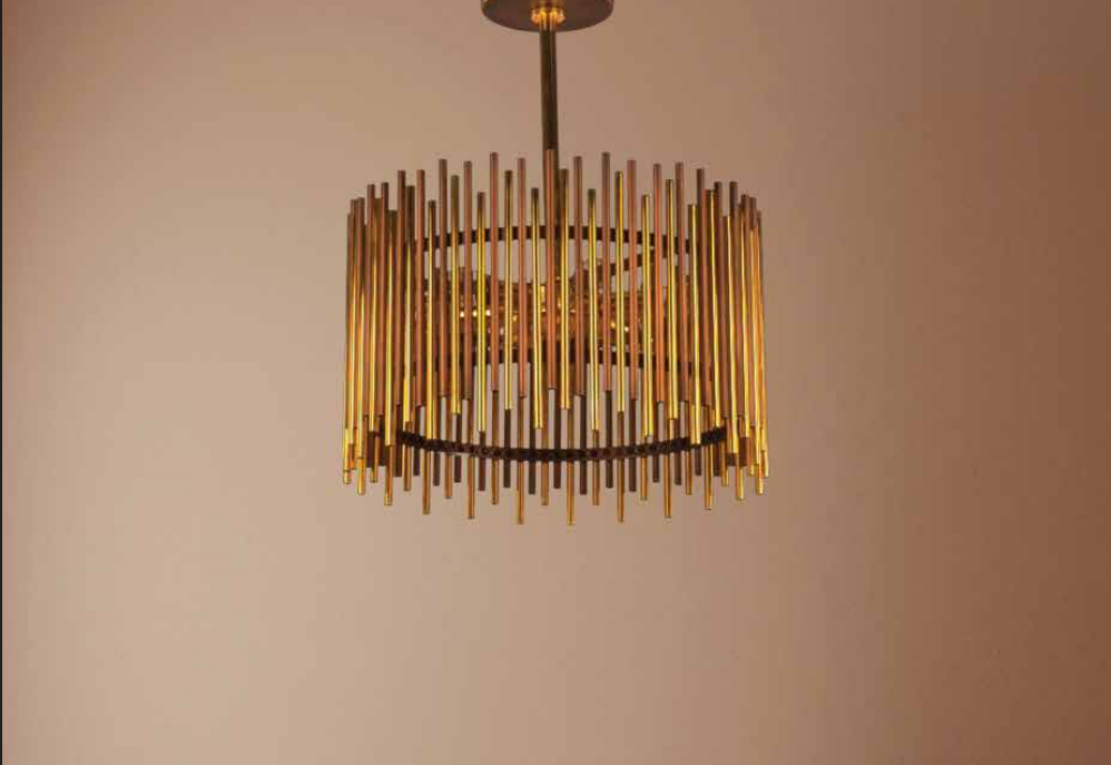 Modern chandelier with gold vertical rods hanging from a circular frame
