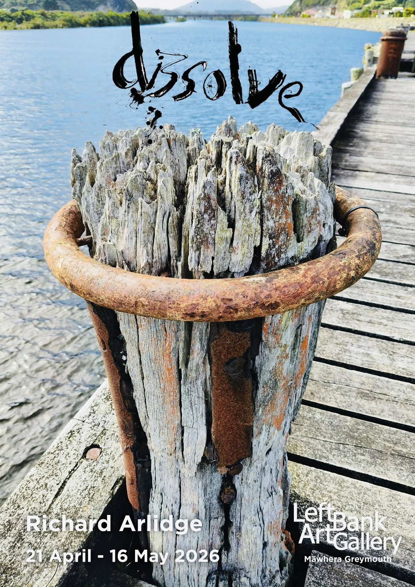 poster with word "dissolve" printed above rotting wharf bollard