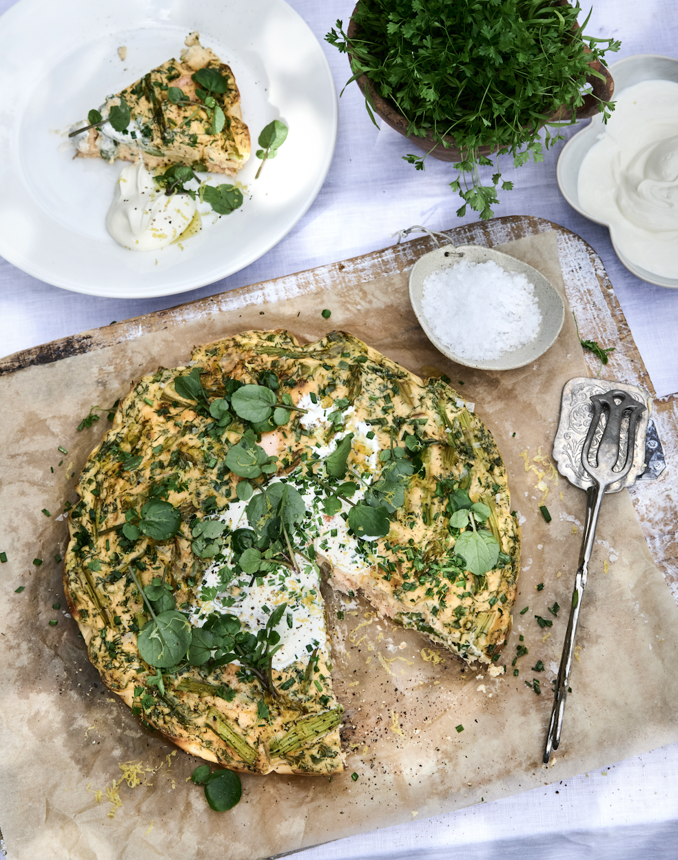 Asparagus and salmon frittata with spring greens and crème fraîche.