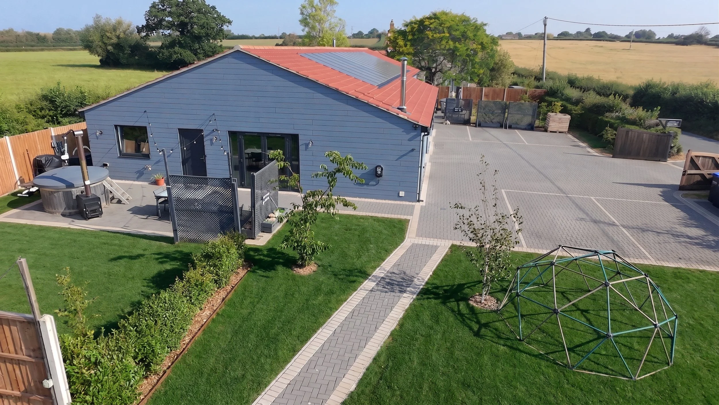 Beautiful rural accessible holiday accommodation featuring multiple disabled parking spaces, secure enclosed grounds, and an accessible hot tub with hoist.