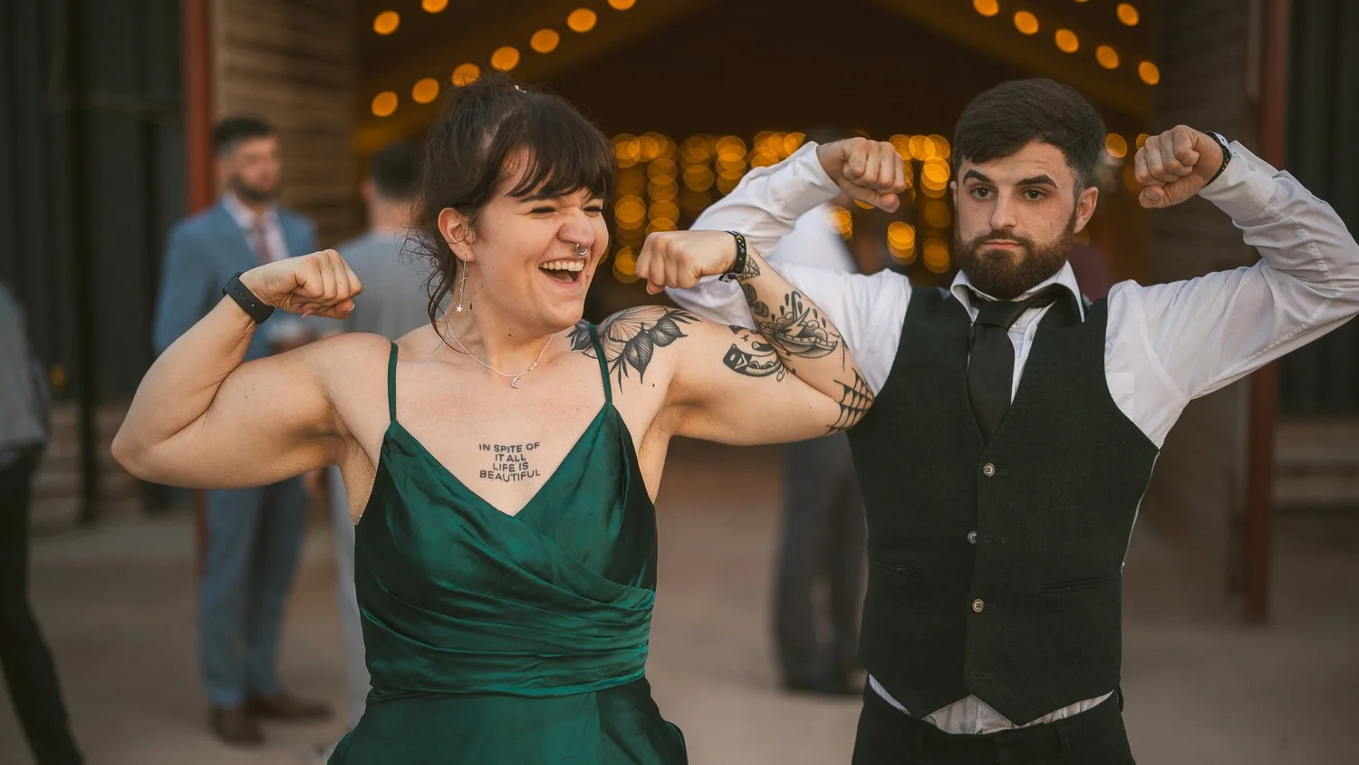 Wedding guests flexing for the camera