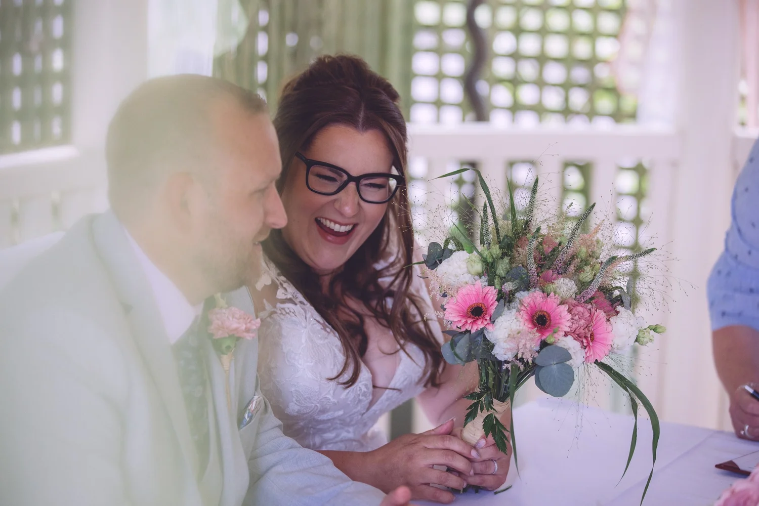 Bride laughing with a guest