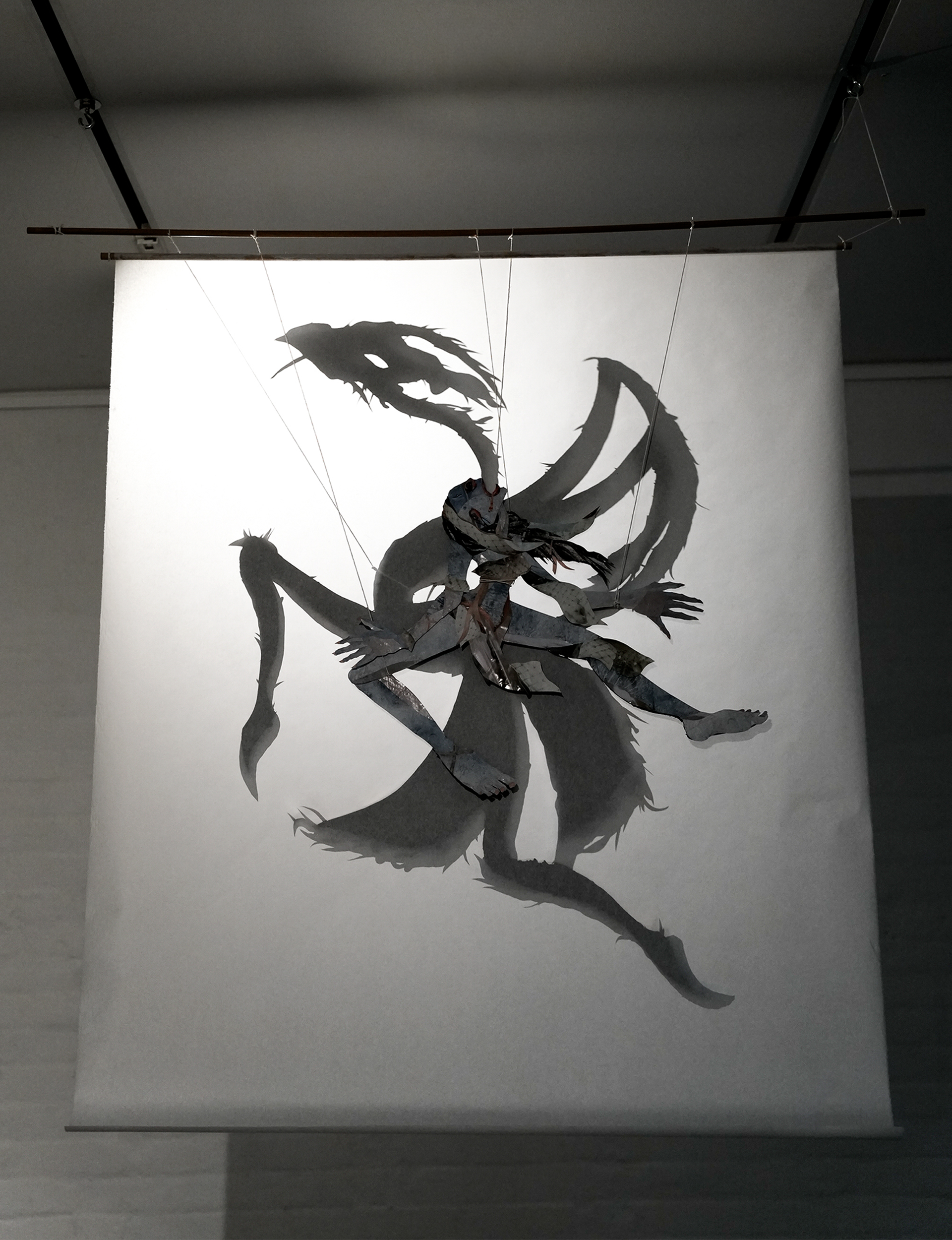 "Parasite" 2025
Ink, cut paper, string, mulberry sheet, wooden dowel, and light
40 x 47 inches (102 x 119 cm)