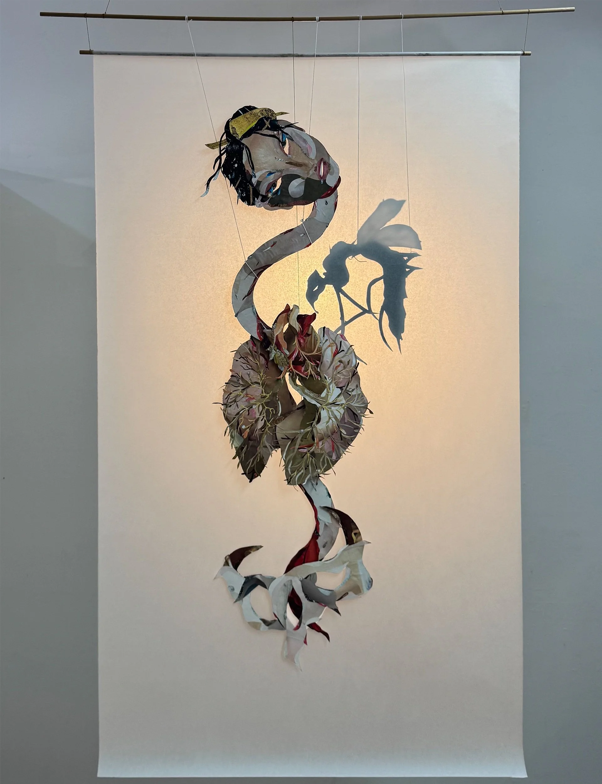 “What is Left Behind I” 2025
Ink, cut paper, string, mulberry sheet, wooden dowel, and light
70 x 38 inches (178 x 97 cm)