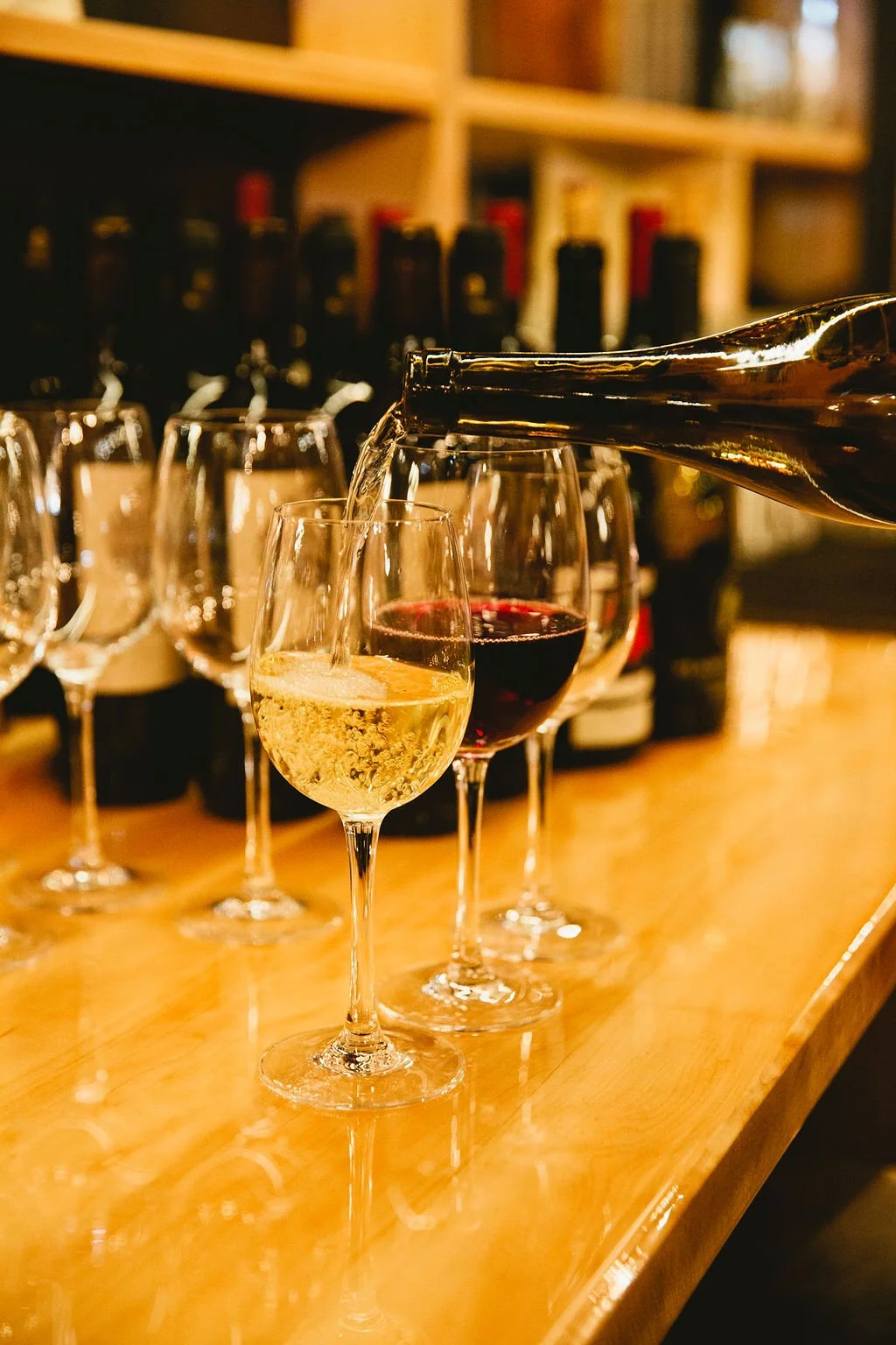 Wine is poured into a glass.