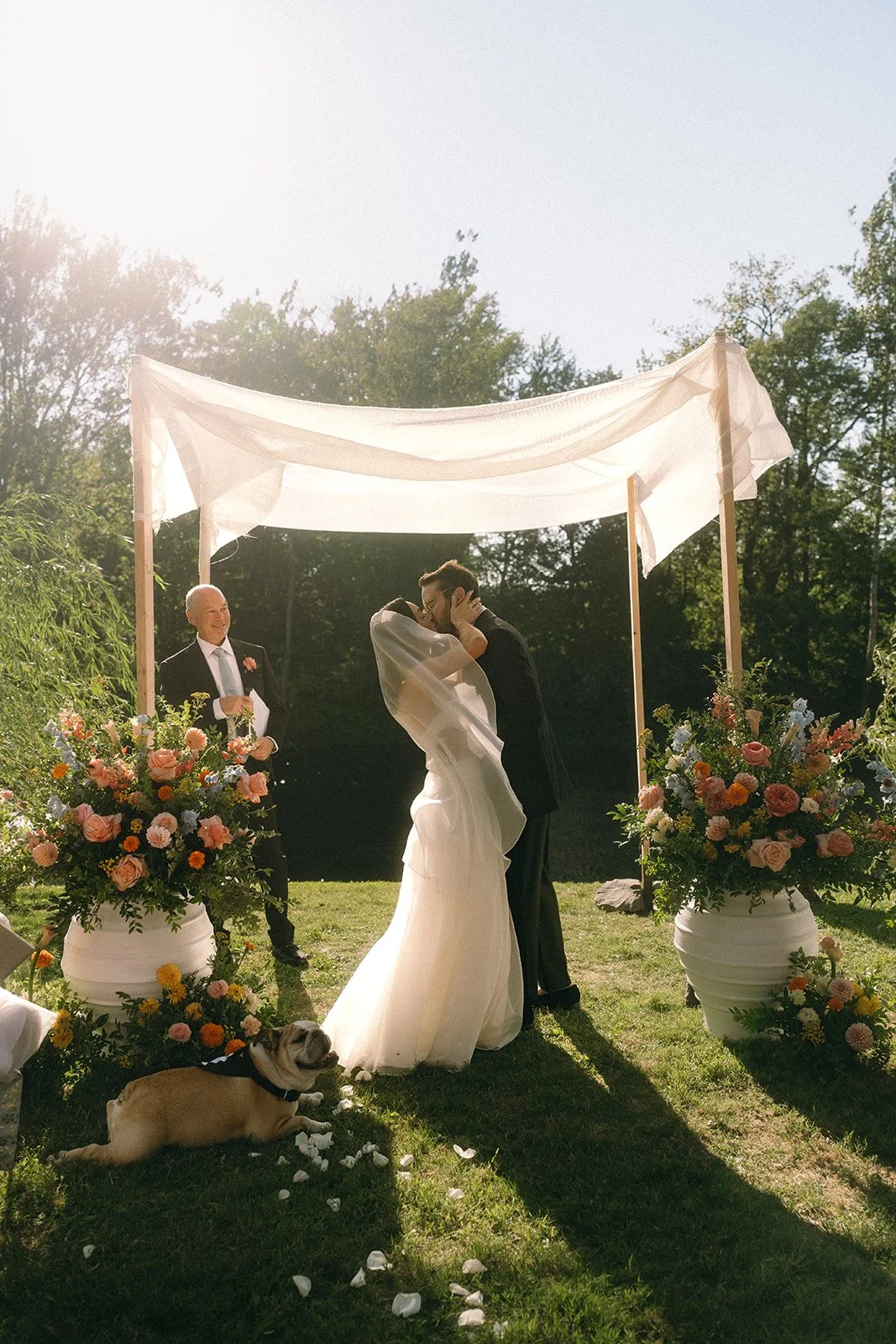 Hudson Valley outdoor wedding ceremony under floral chuppah Service Matters North East