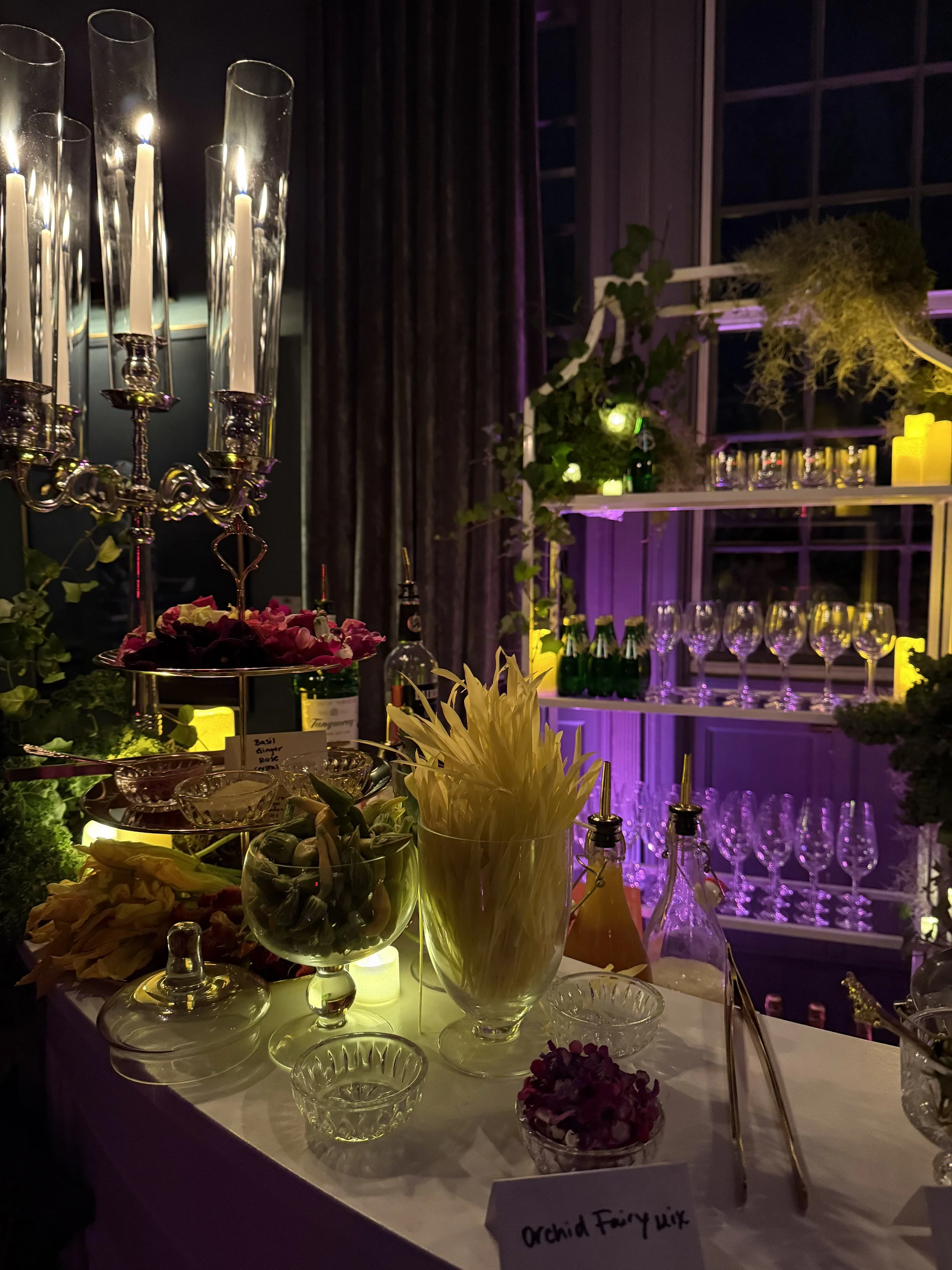 Perrier brand activation styled cocktail garnish station with candelabra and floral decor Service Matters North East