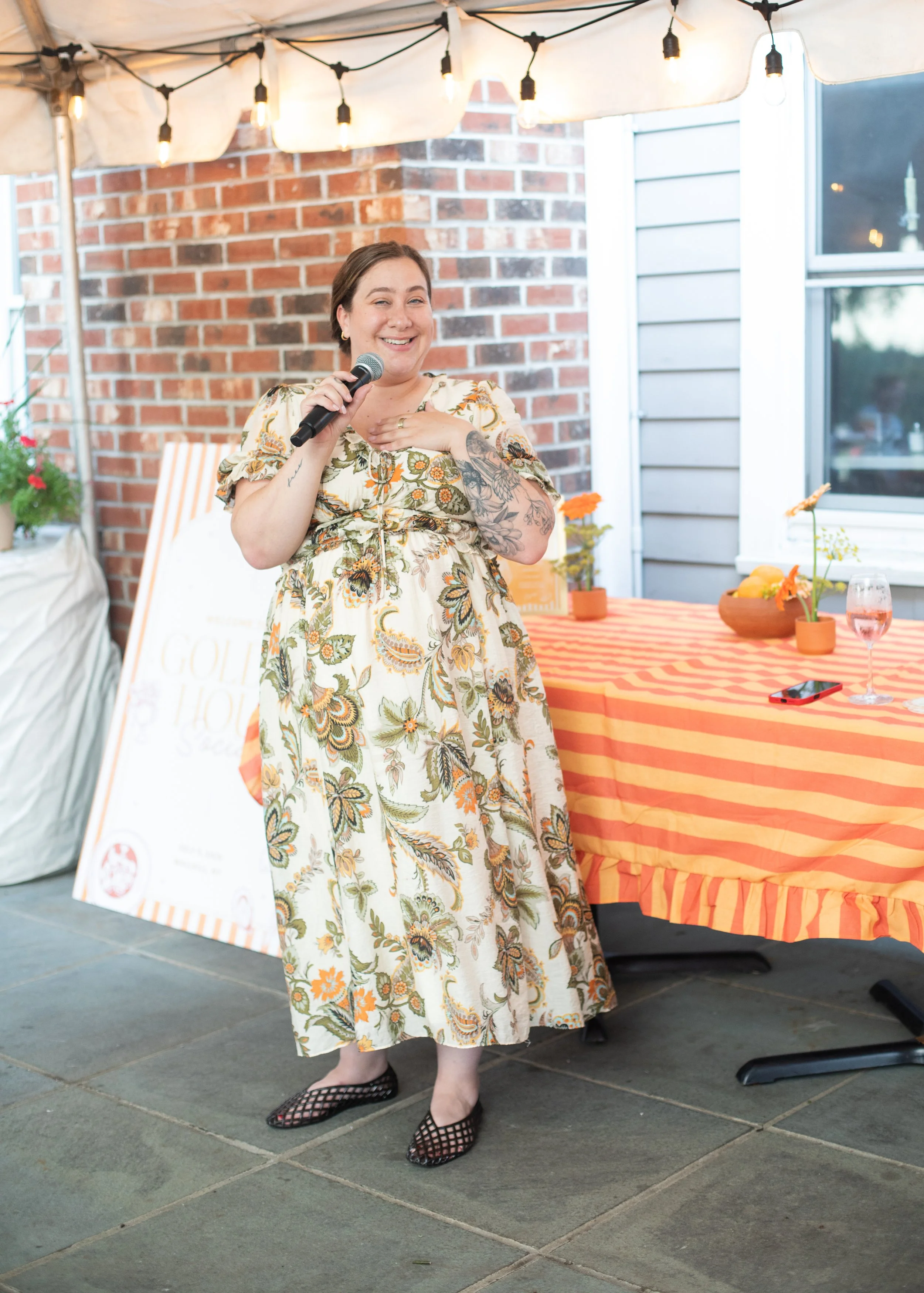 Katie, founder of The Wedding Planners Collective, speaking to attendees during the Golden Hour Social networking event in Wallkill, New York.