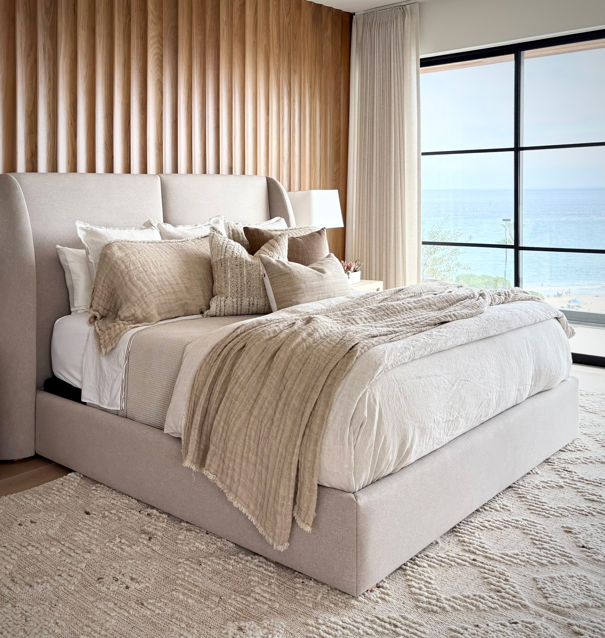 Relaxed modern coastal interior design primary bedroom by the ocean in Newport Beach, Orange County, CA