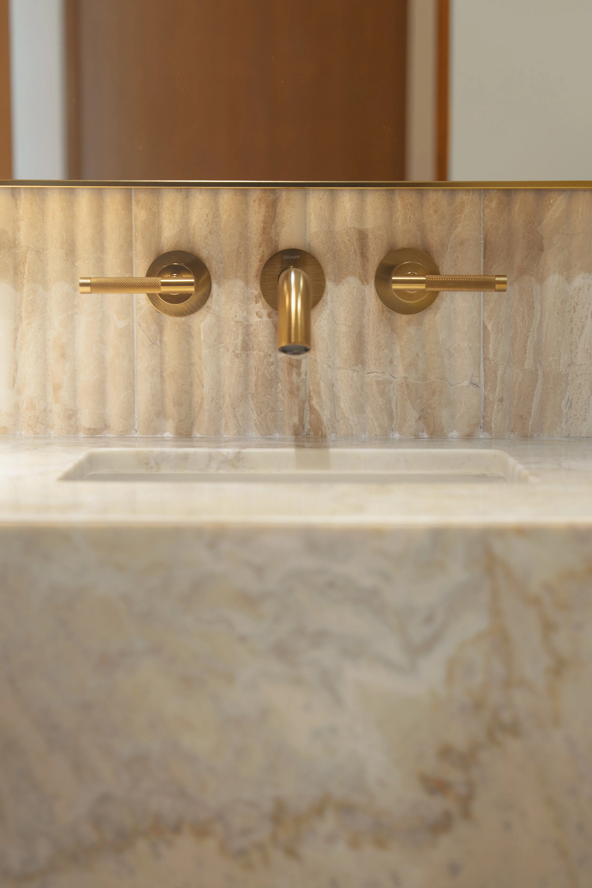 Jonathons Coastal Living interior design custom guest bathroom remodel with luxury. feminine, serene spa-like vanity design, showcasing fluted marble tile in Dana Point, Orange County, CA