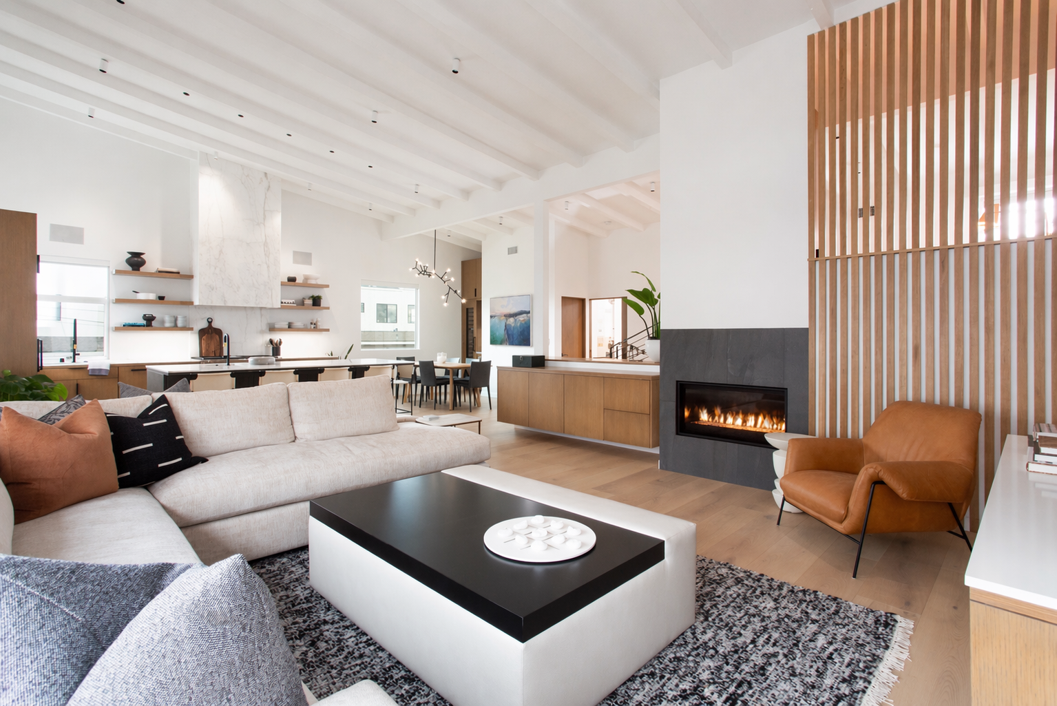 Minimal modern loft interior design living room with custom sectional in Corona Del Mar, Orange County, CA