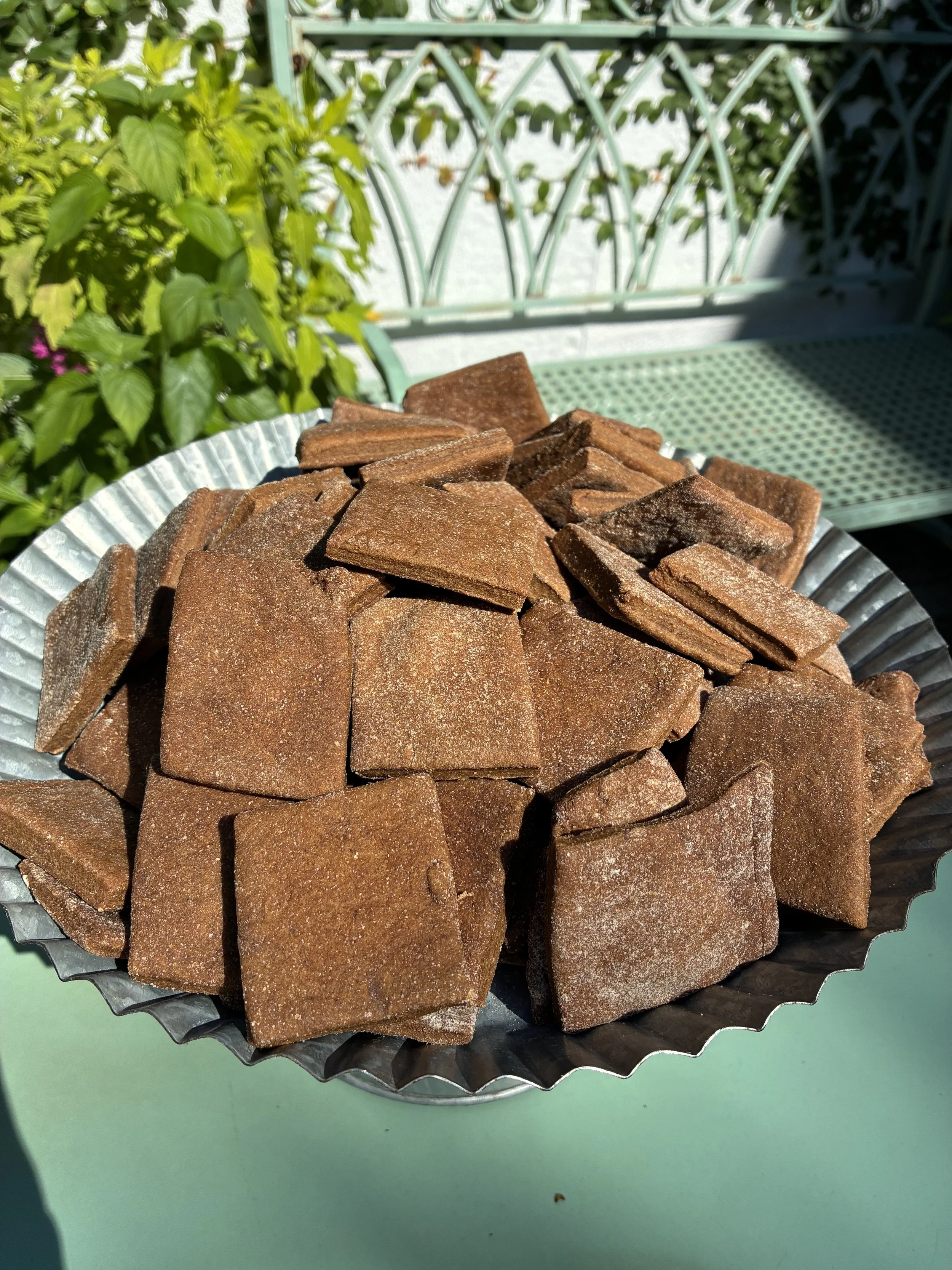 dog treats in a bowl inside a lovely courtyard