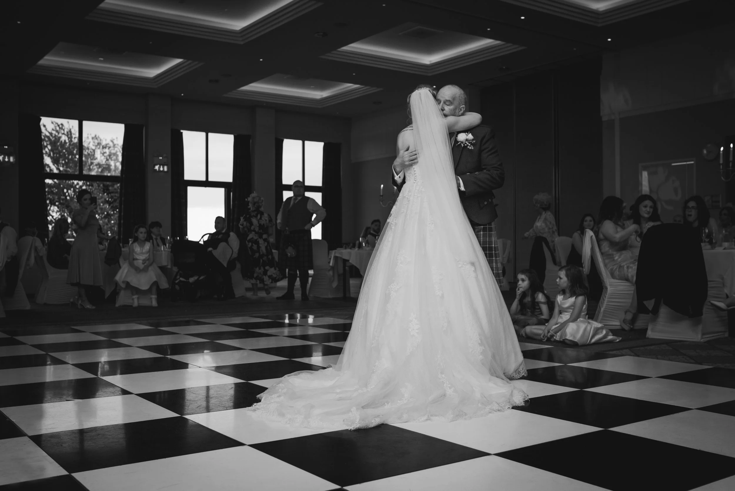 Bride and her father sharing a dance at the wedding reception