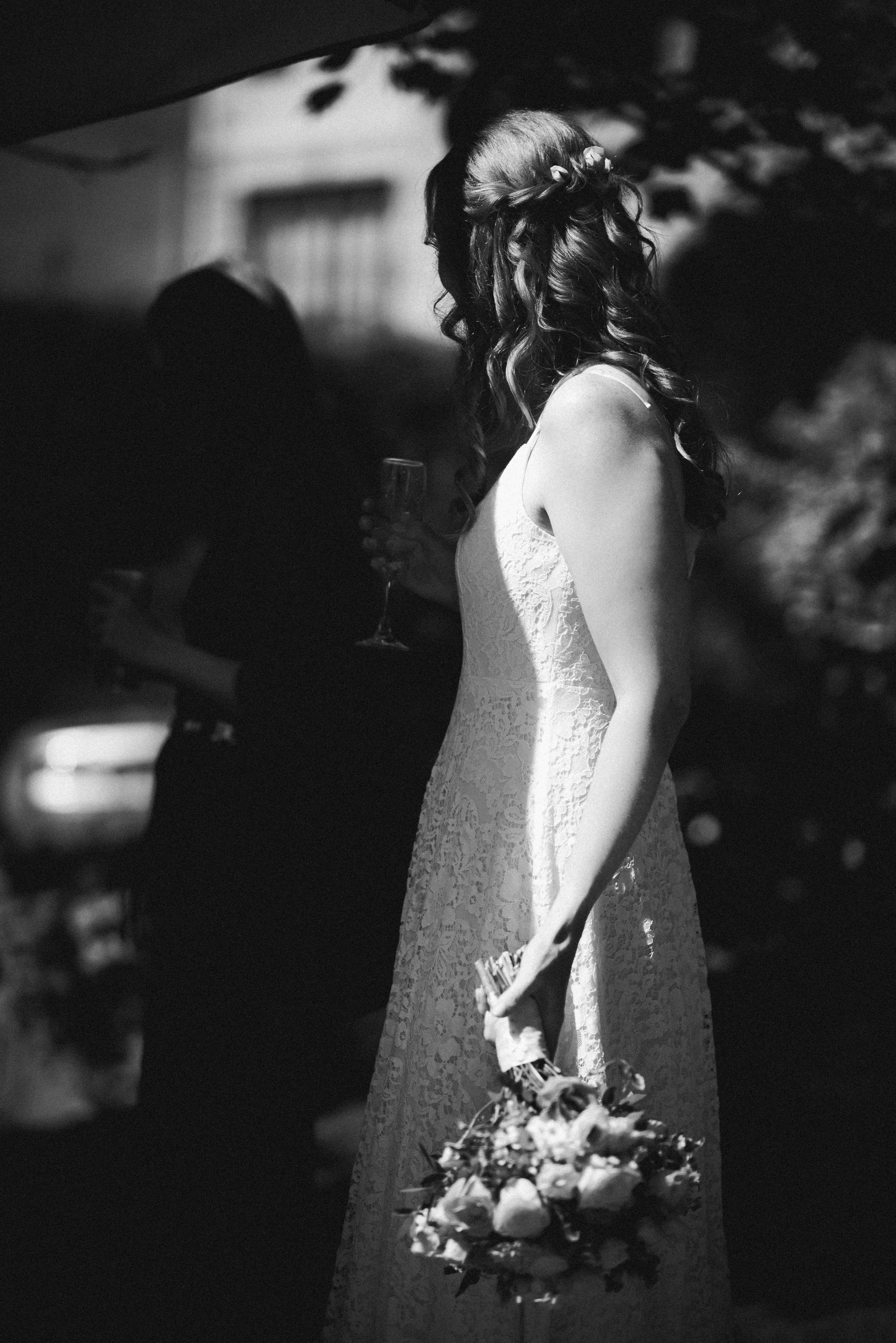 Bride holding her bouquet in beautiful natural light during her wedding reception